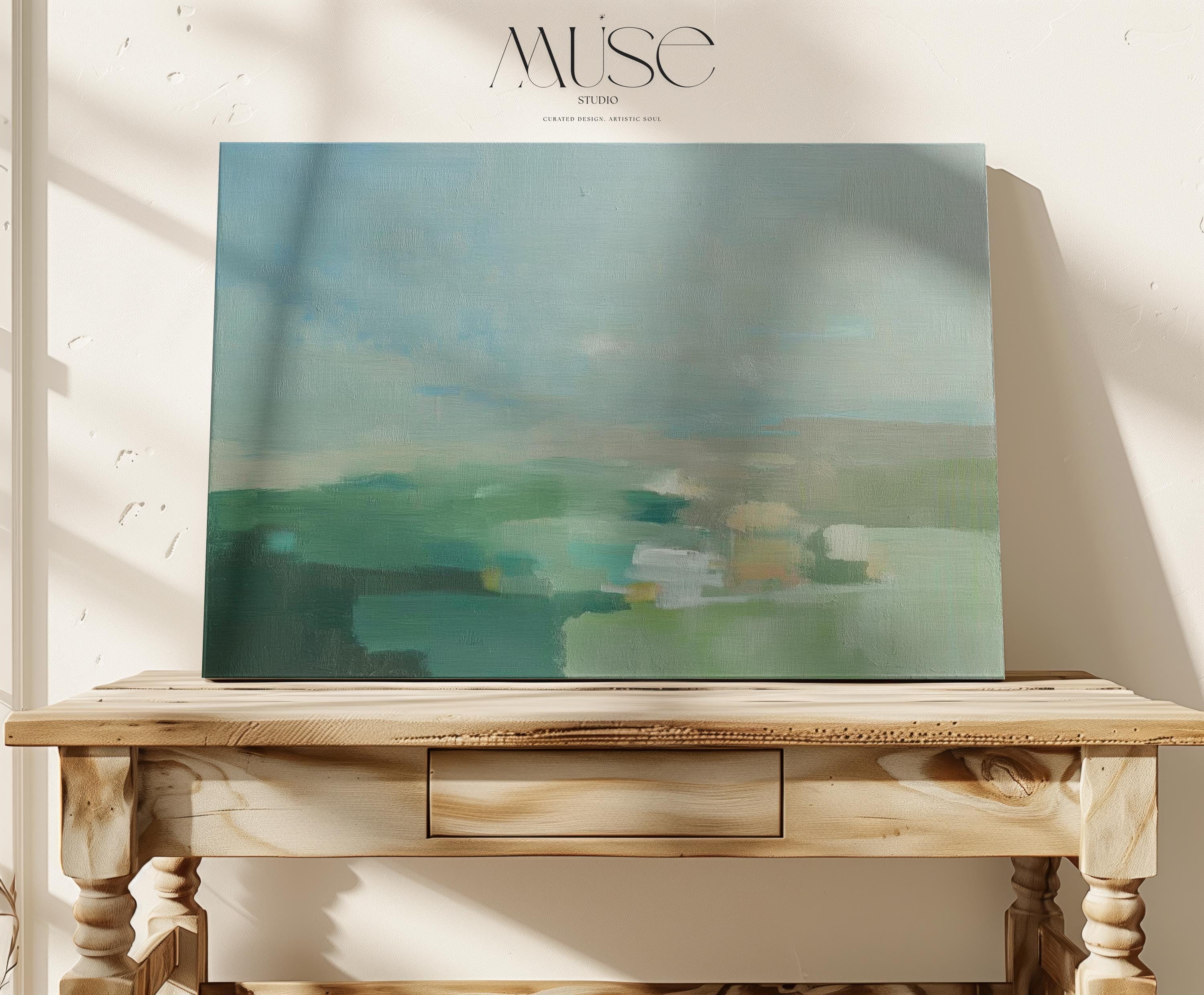 Horizontal abstract wall art in sage green, teal, and muted earth tones with soft blended brushstrokes that resemble a peaceful horizon. Large calming artwork designed for minimalist, nature-inspired, and coastal interiors. Perfect for living rooms, bedrooms, or entryways seeking serene modern decor. Available as gallery-wrapped canvas, framed canvas, or fine art print for versatile styling.