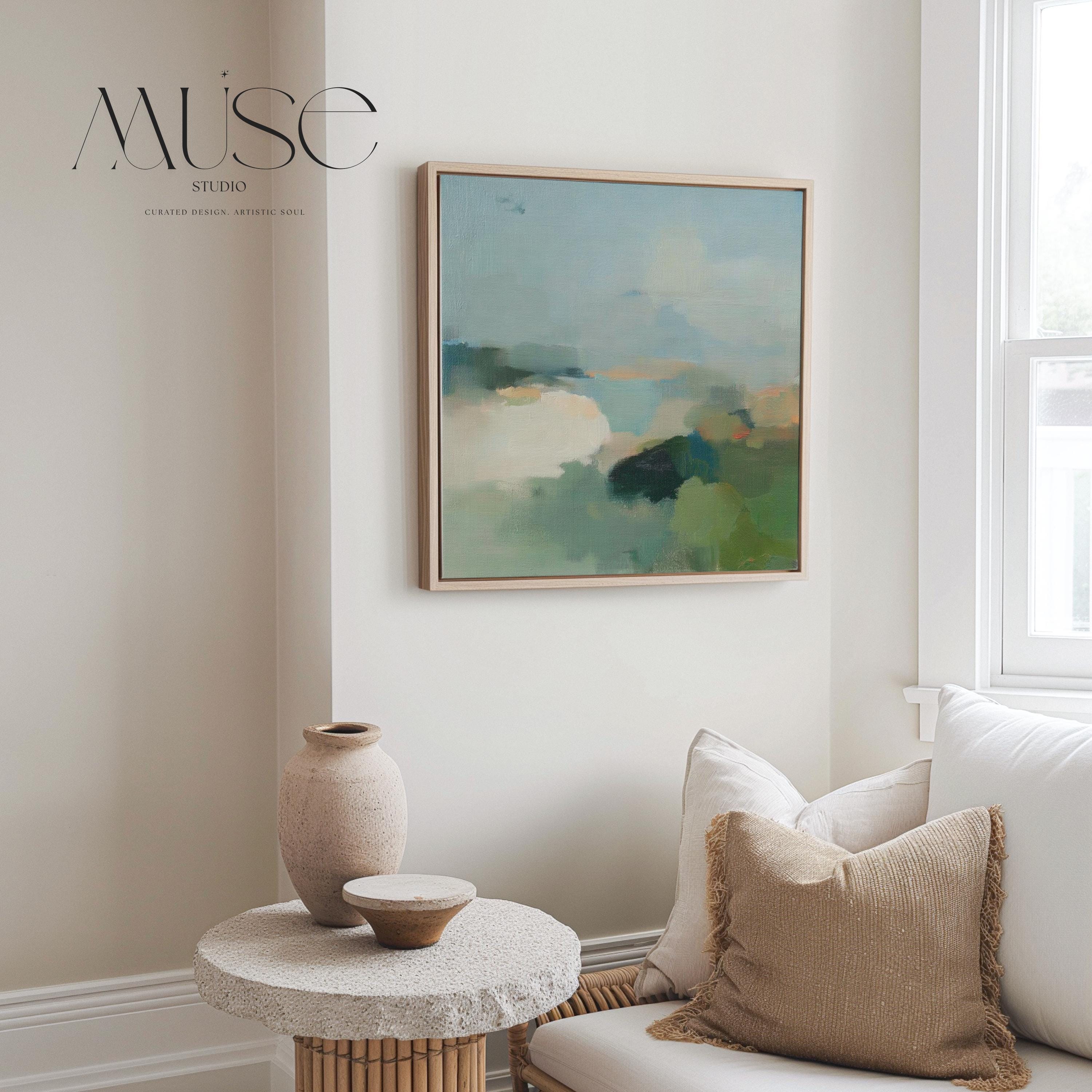 Square abstract wall art in sage green, soft blue, and muted neutrals with horizon-inspired brushstrokes. Large calming canvas decor designed for living rooms, bedrooms, or entryways. Styled for soft contemporary and nature-inspired interiors, perfect as a statement piece. Available as gallery-wrapped canvas, framed canvas, or fine art print.