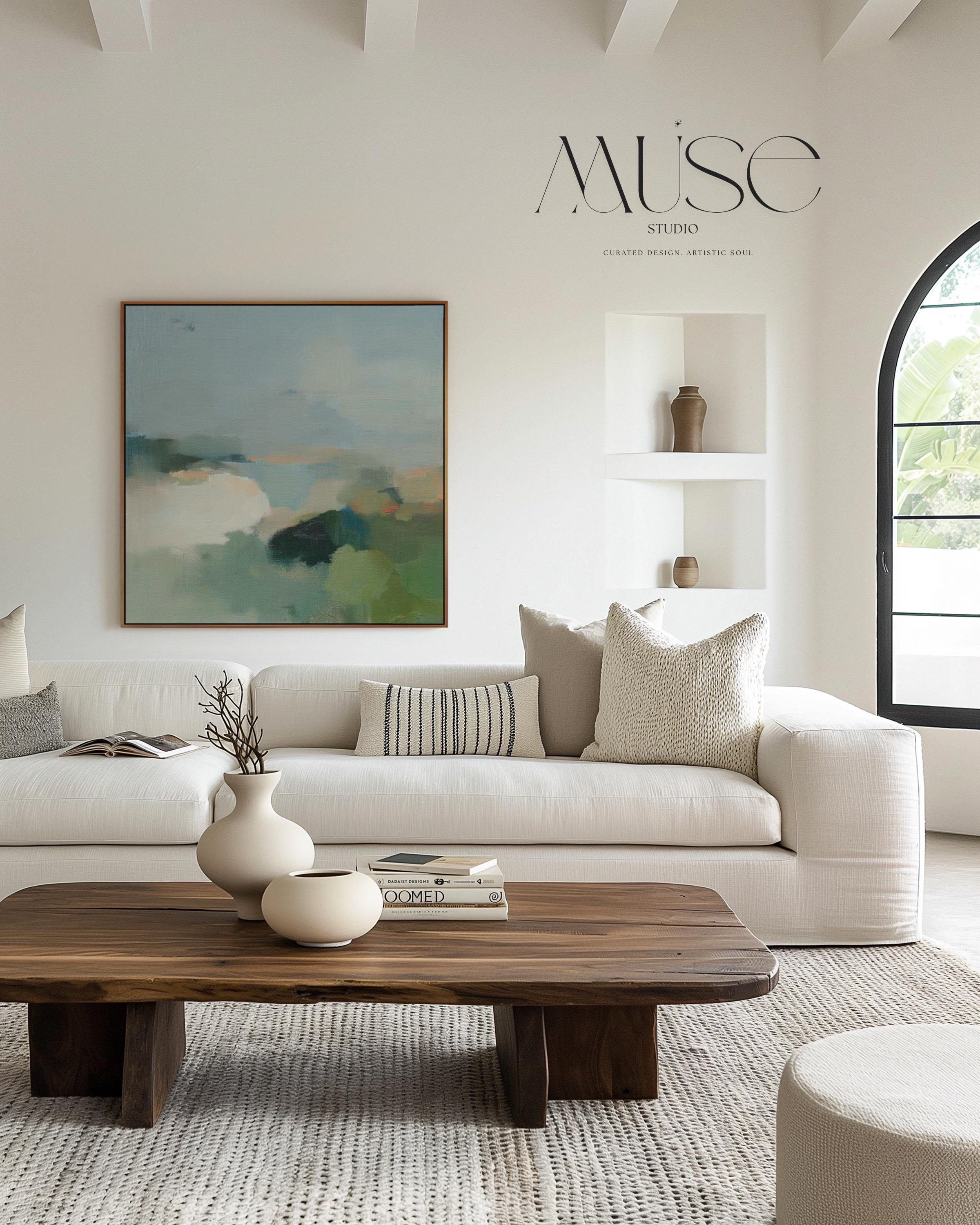 Square abstract wall art in sage green, soft blue, and muted neutrals with horizon-inspired brushstrokes. Large calming canvas decor designed for living rooms, bedrooms, or entryways. Styled for soft contemporary and nature-inspired interiors, perfect as a statement piece. Available as gallery-wrapped canvas, framed canvas, or fine art print.