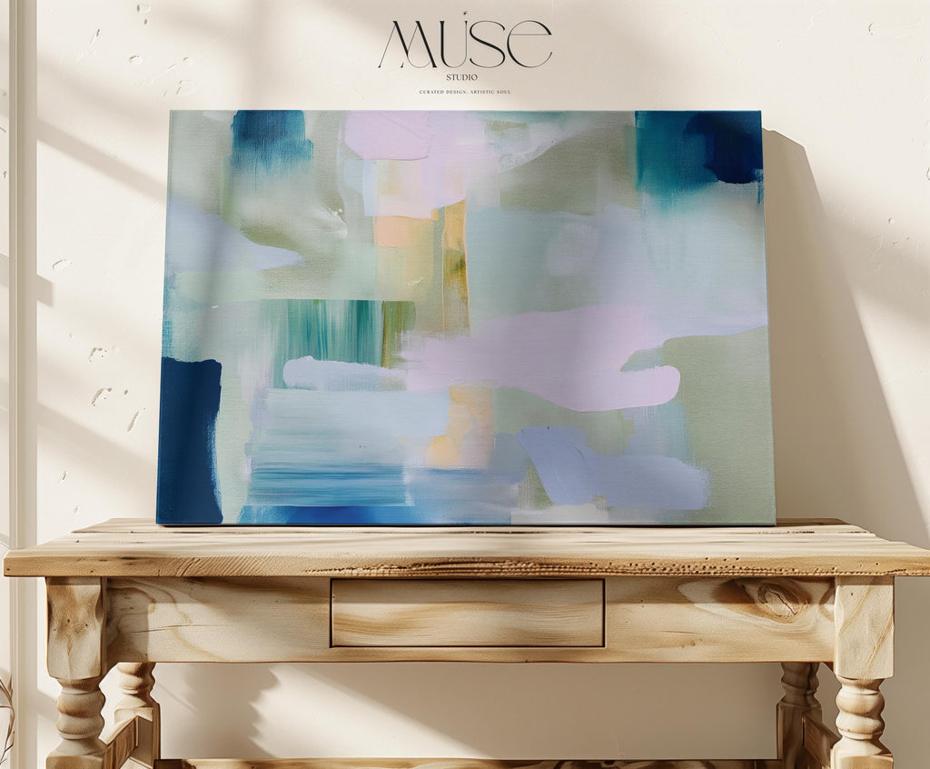 Horizontal abstract canvas wall art featuring sage, teal, and blush brushstrokes in a layered horizon style. The oversized painting reflects transitional and soft contemporary design, ideal for living rooms, offices, or dining rooms. Offered as a gallery-wrapped canvas for modern, designer-forward decor.