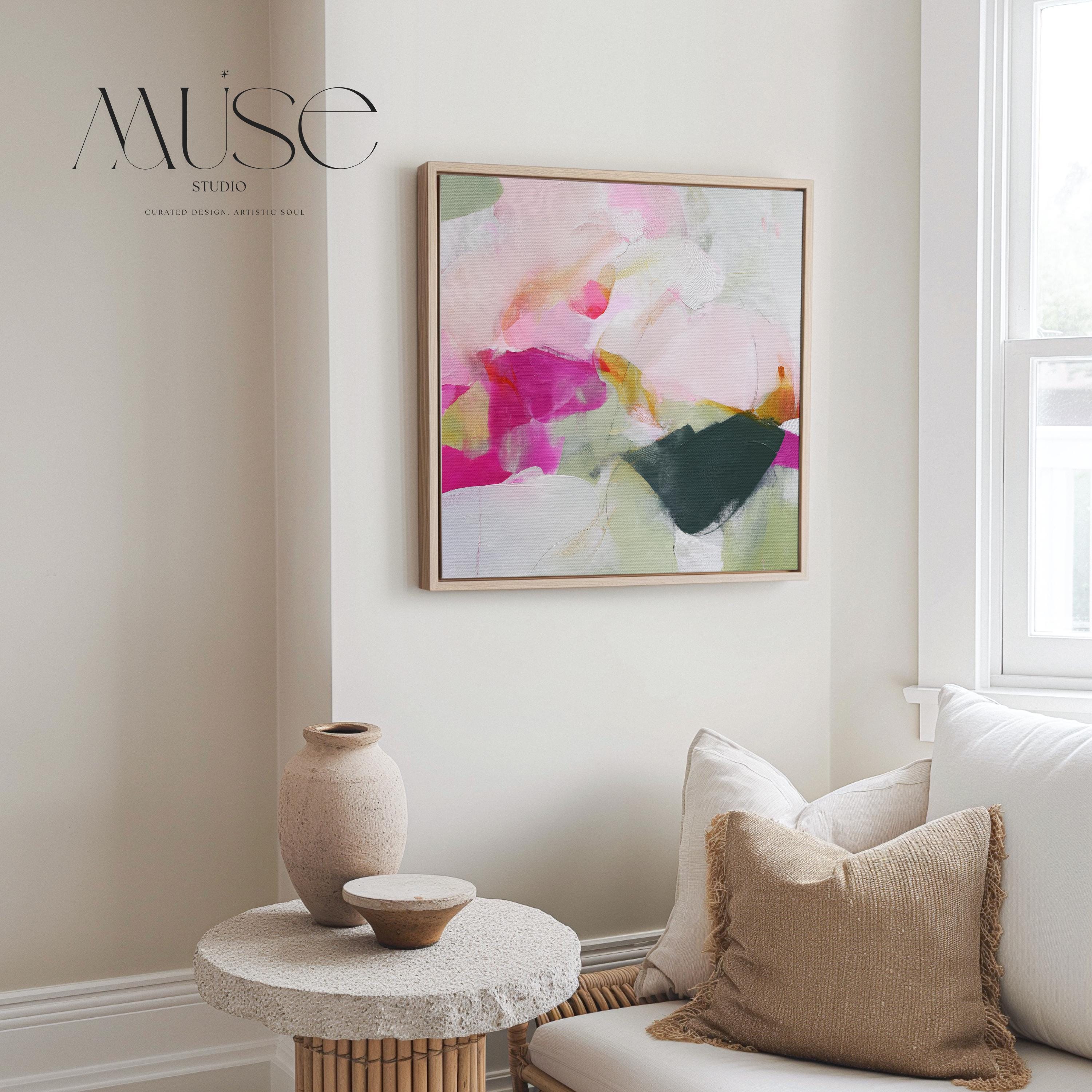 Square framed abstract canvas wall art in pink, blush, and green tones with pastel layers and bold color pop accents. Designed with a lively, artistic energy that complements boho, soft contemporary, and color-forward interiors. Ideal for dining rooms, living rooms, or entryway statement decor. Available as a gallery-wrapped canvas, framed canvas, or fine art poster print for curated boutique wall art styling.