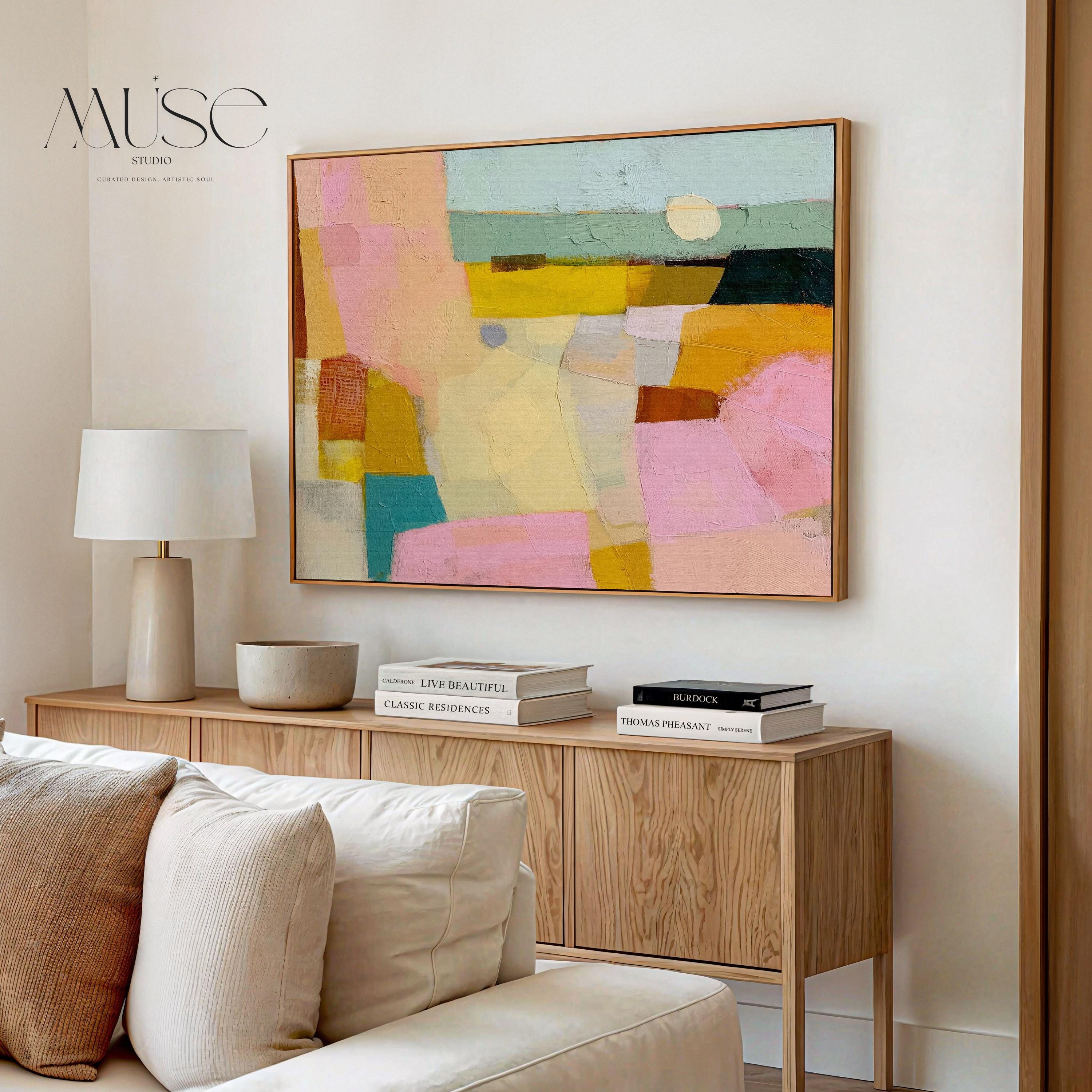 Horizontal abstract canvas wall art with pink, yellow, teal, and neutral tones in a painterly geometric design. This textured pastel artwork blends boho and modern styles, ideal for living rooms, bedrooms, or entryway walls. Its bold color palette adds vibrancy while maintaining balance, perfect for transitional and contemporary interiors. Available as a gallery-wrapped canvas, framed canvas, or fine art poster print for versatile boutique home decor.