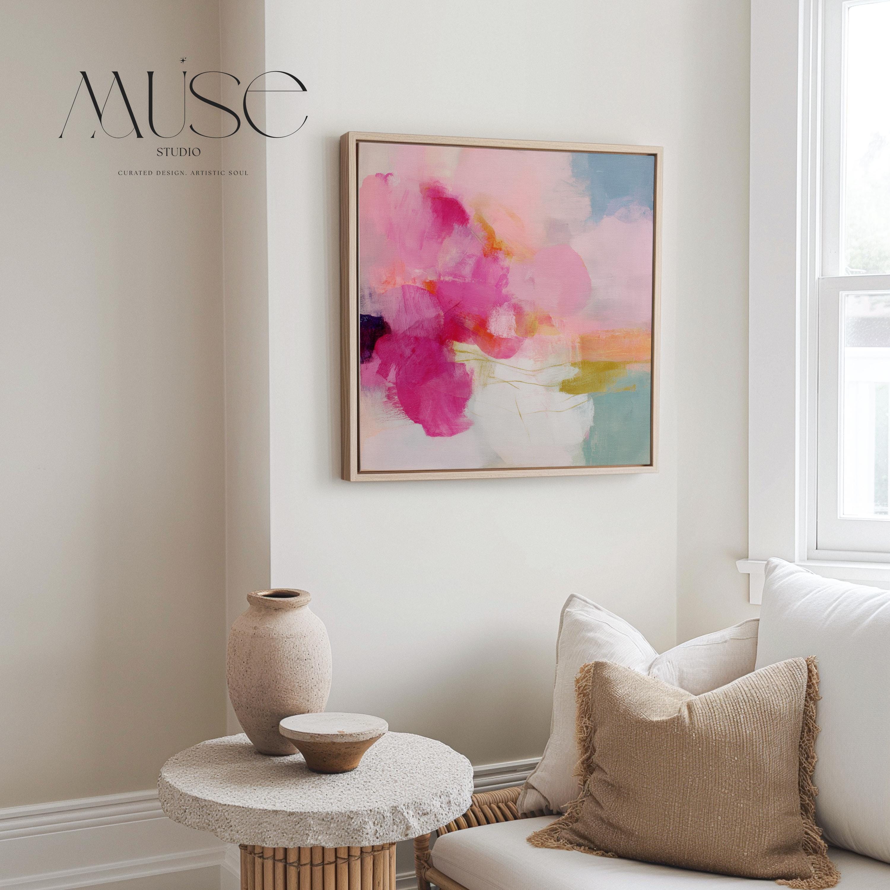 Framed square canvas wall art featuring bold pink and coral brushstrokes with teal and golden undertones. This abstract artwork blends boho, transitional, and soft contemporary design, perfect for bedrooms, living rooms, or entryway decor. Available as framed or gallery-wrapped canvas.