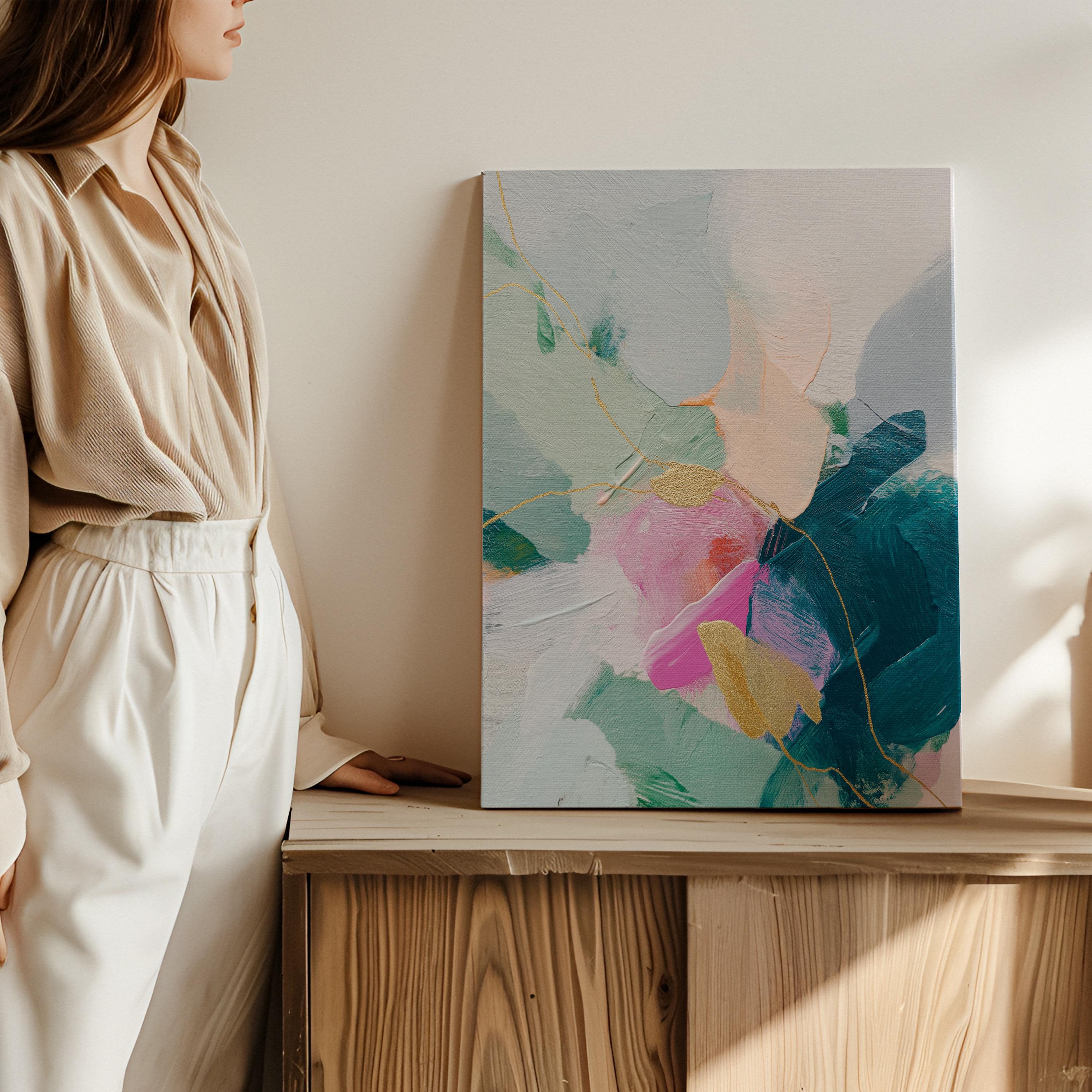 Vertical abstract canvas wall art featuring teal, blush pink, and gold accents with layered brush texture. Designed for transitional and modern interiors, this piece enhances bedrooms, hallways, or living rooms. Available framed or as a gallery-wrapped canvas for curated, designer-forward decor.