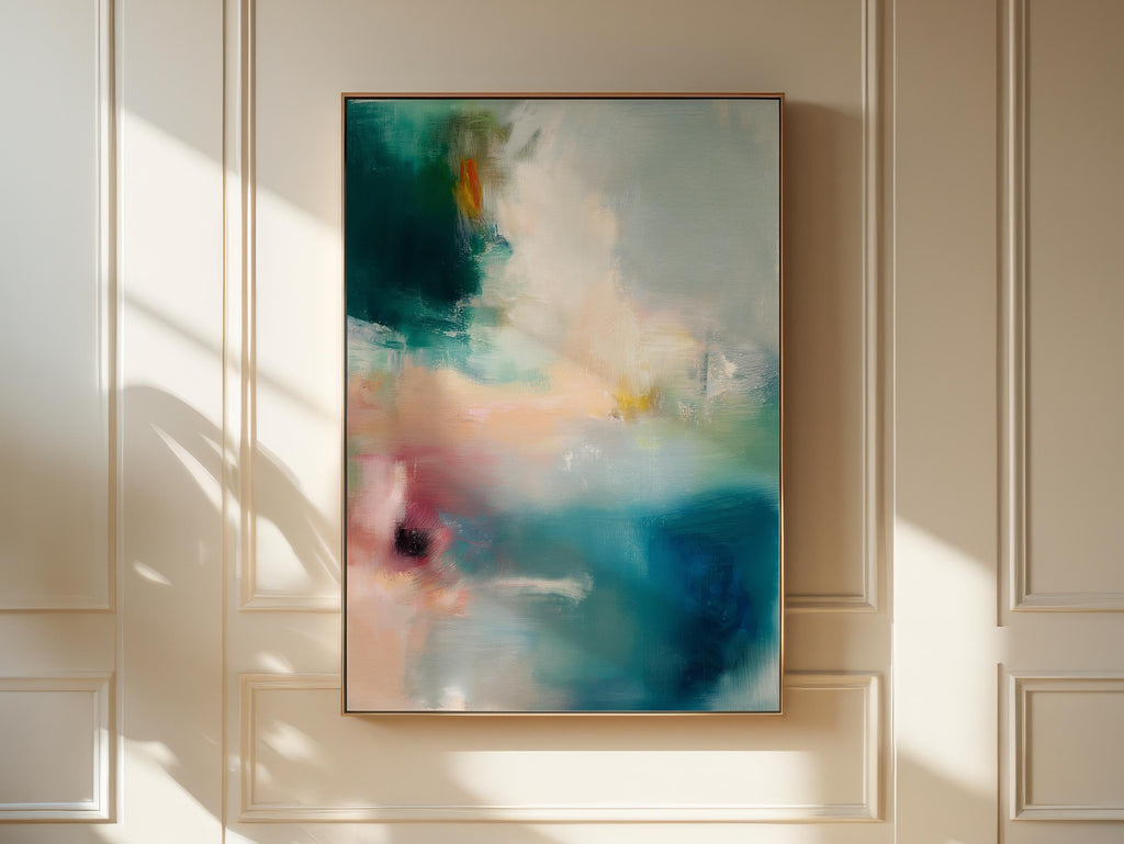 Vertical abstract canvas wall art featuring teal, blush, and gold tones with layered brushwork. The soft contemporary palette enhances modern and transitional interiors, ideal for bedrooms or living spaces. Available as a framed or gallery-wrapped canvas for designer-inspired decor.