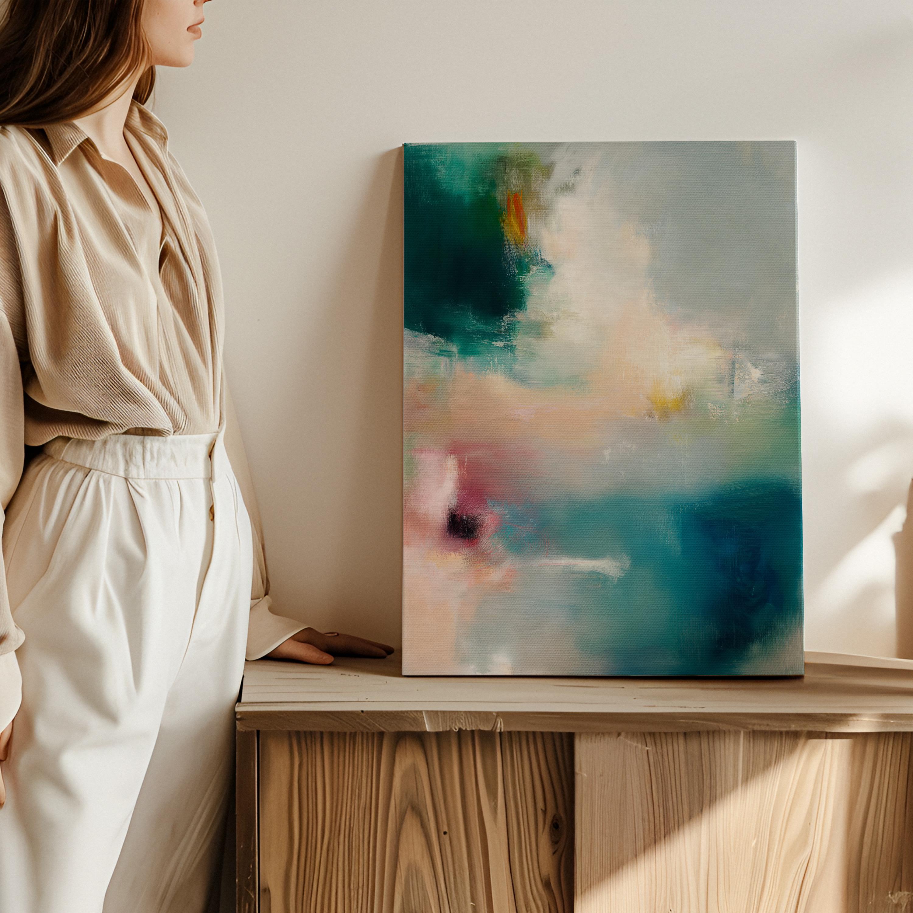 Large vertical abstract canvas wall art featuring teal, blush pink, and gold tones in layered brushstrokes. The soft coastal palette and luminous texture complement transitional, modern, and soft contemporary interiors. Available as a gallery-wrapped canvas in multiple sizes for curated, designer-forward decor.