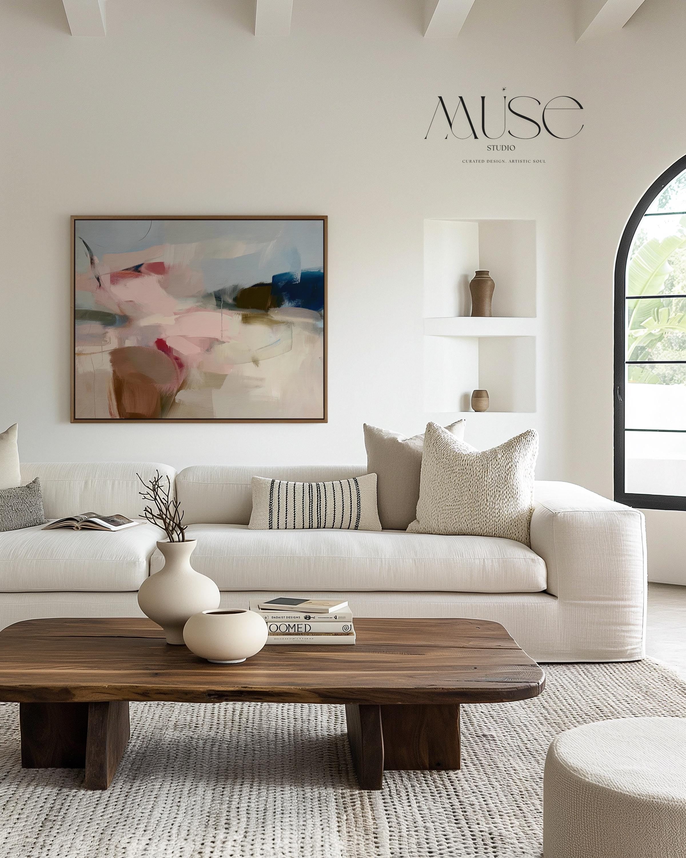 Horizontal abstract canvas wall art in soft blush, navy, and taupe tones with gentle painterly movement. The textured brushwork evokes warmth and calm, ideal for modern living rooms or bedrooms. Printed on premium cotton canvas, this gallery-wrapped piece arrives ready to hang for a clean, contemporary finish.