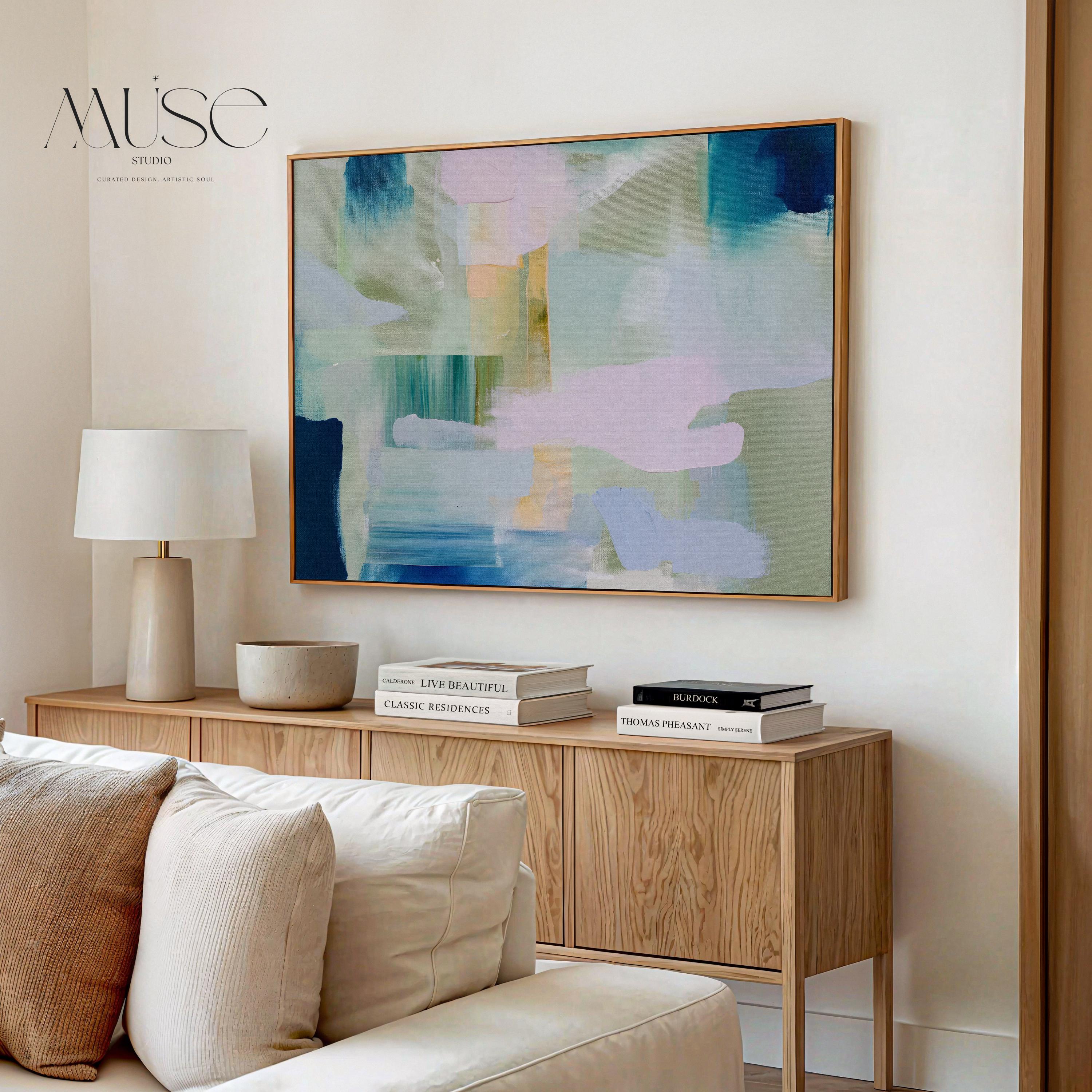 Large horizontal abstract wall art titled Quiet Tides, featuring soft sage green and pale blue tones with dark navy and light pink accents. A contemporary minimalist canvas designed for living rooms and bedrooms, offering a calm, modern statement with subtle color and organic movement.
