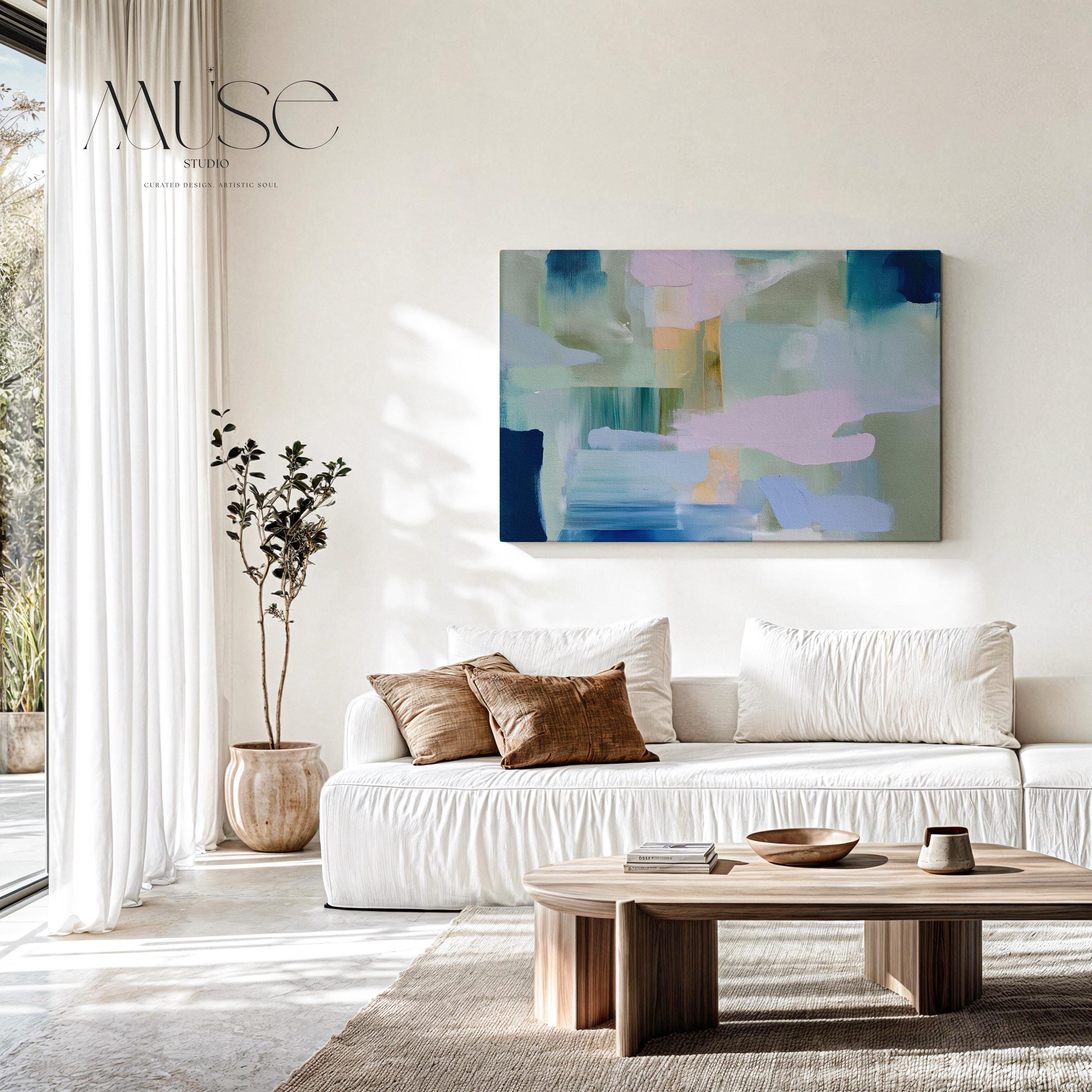 Horizontal abstract canvas wall art featuring sage, teal, and blush brushstrokes in a layered horizon style. The oversized painting reflects transitional and soft contemporary design, ideal for living rooms, offices, or dining rooms. Offered as a gallery-wrapped canvas for modern, designer-forward decor.