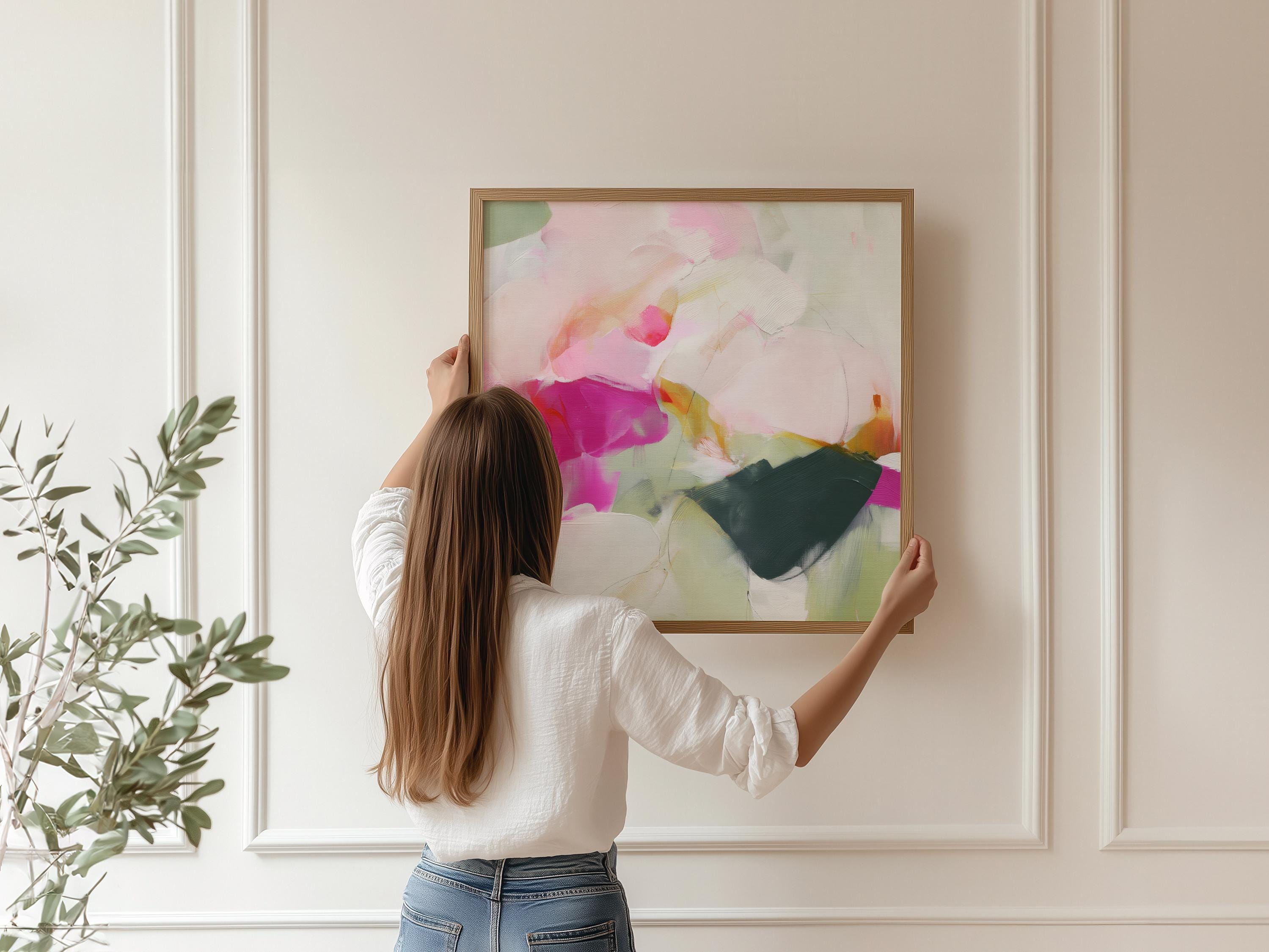 Square abstract wall art titled Petal Field, featuring soft pink and muted green tones arranged in an organic, contemporary composition. A modern minimalist canvas print designed for bedrooms and living rooms, offering calm color and balanced visual interest.