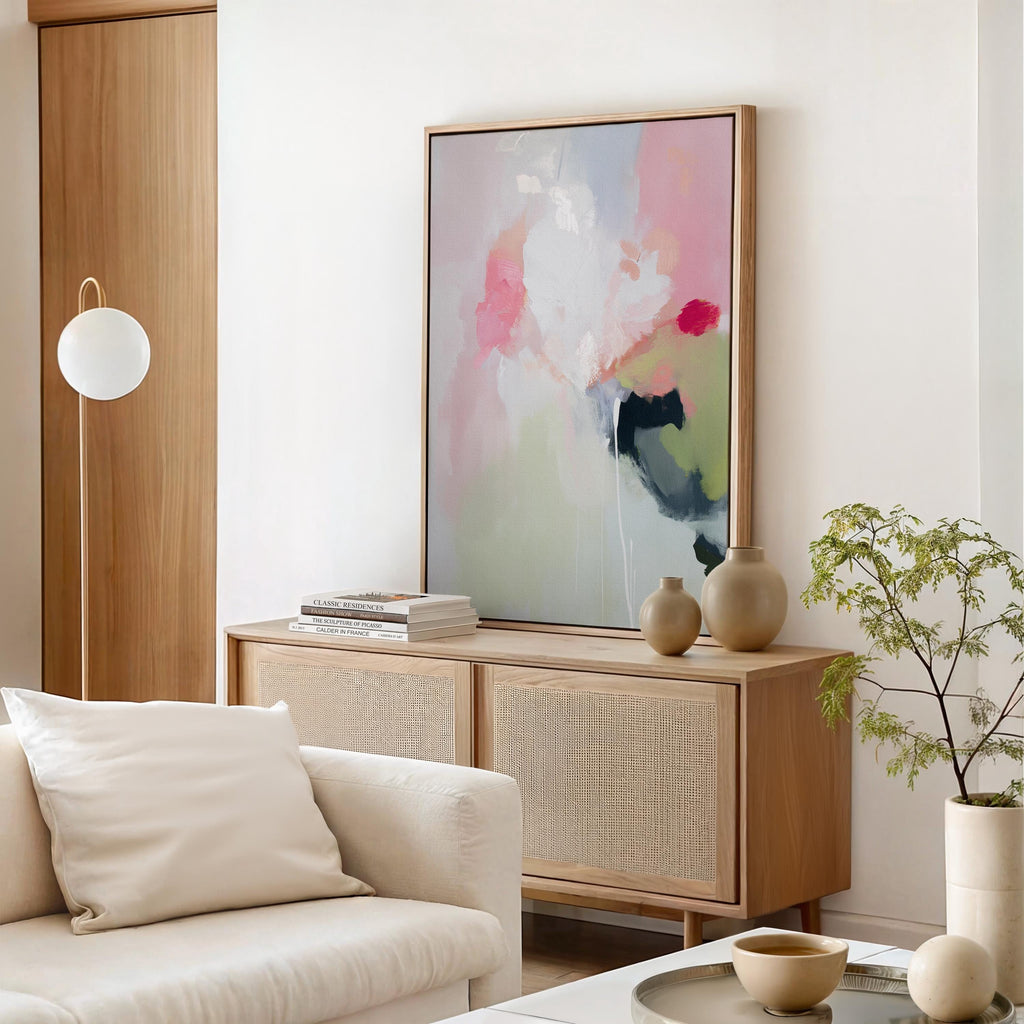 Vertical abstract canvas wall art featuring blush pink, soft green, and muted pastel tones in a warm minimalist style. This artwork offers a serene and calming presence, ideal for bedrooms, living rooms, or entryways. Designed for layered, neutral interiors, it blends easily with contemporary and designer home decor. Available as a gallery-wrapped canvas, framed canvas, or fine art poster print for curated boutique styling.