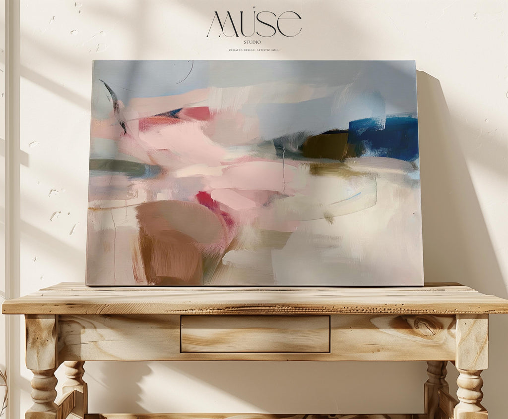Abstract canvas wall art featuring soft blush, taupe, and navy tones with flowing brushstrokes and painterly texture. The horizontal composition evokes calm movement and balanced warmth, ideal for bedrooms or living rooms. Gallery-wrapped cotton canvas for a refined, ready-to-hang presentation.