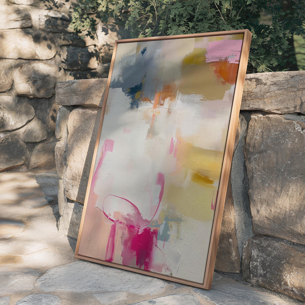 Vertical abstract canvas wall art featuring blush pink, gold, taupe, and soft blue hues in a soft contemporary color pop palette. The artwork adds warmth and elegance to modern interiors, perfect for living rooms, bedrooms, or entryways. Its layered brushwork and inviting tones create a sophisticated, designer look. Available as a gallery-wrapped canvas, framed canvas, or fine art poster print.