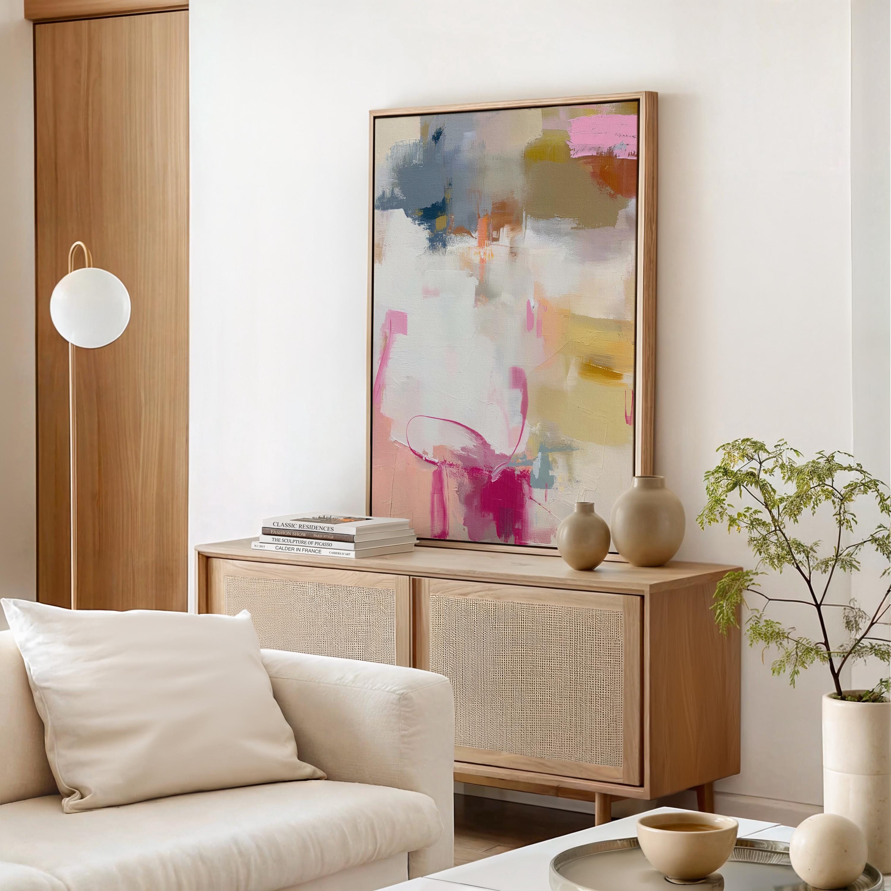 Large vertical framed abstract canvas wall art by Muse Studio featuring blush pink and soft gold tones with taupe and muted blue accents, printed with museum-grade giclée inks on premium artist canvas and professionally framed in solid wood for gallery-quality presentation in soft contemporary interiors.