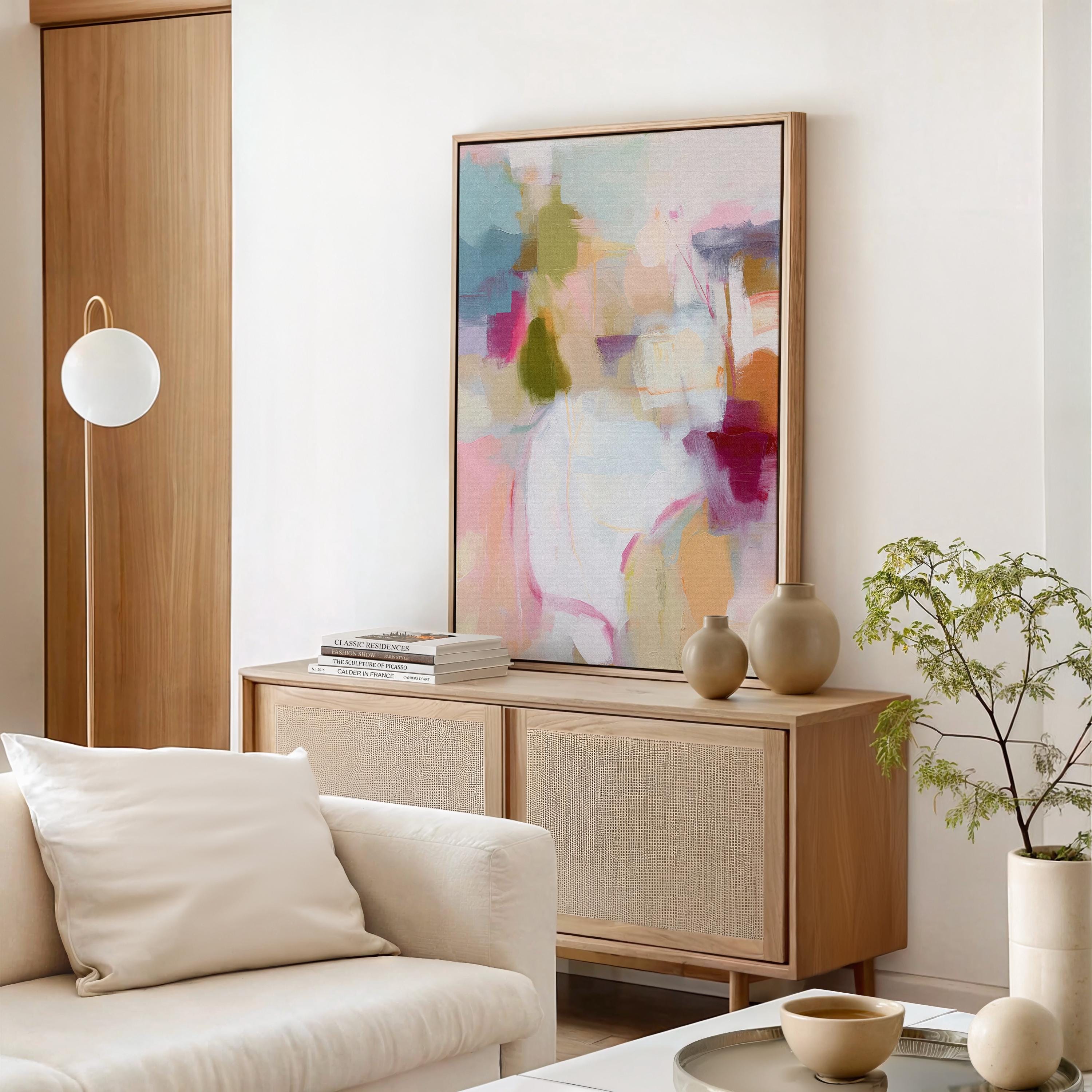 ertical framed abstract wall art in blush pink, olive green, coral, and lavender tones. Soft painterly brushwork creates a light and inviting aesthetic perfect for pastel botanical or soft contemporary interiors. Ideal for living rooms, bedrooms, or entryways, this design adds warmth and joy to curated, modern spaces. Available as a framed canvas wall art, gallery-wrapped canvas, or fine art poster print.