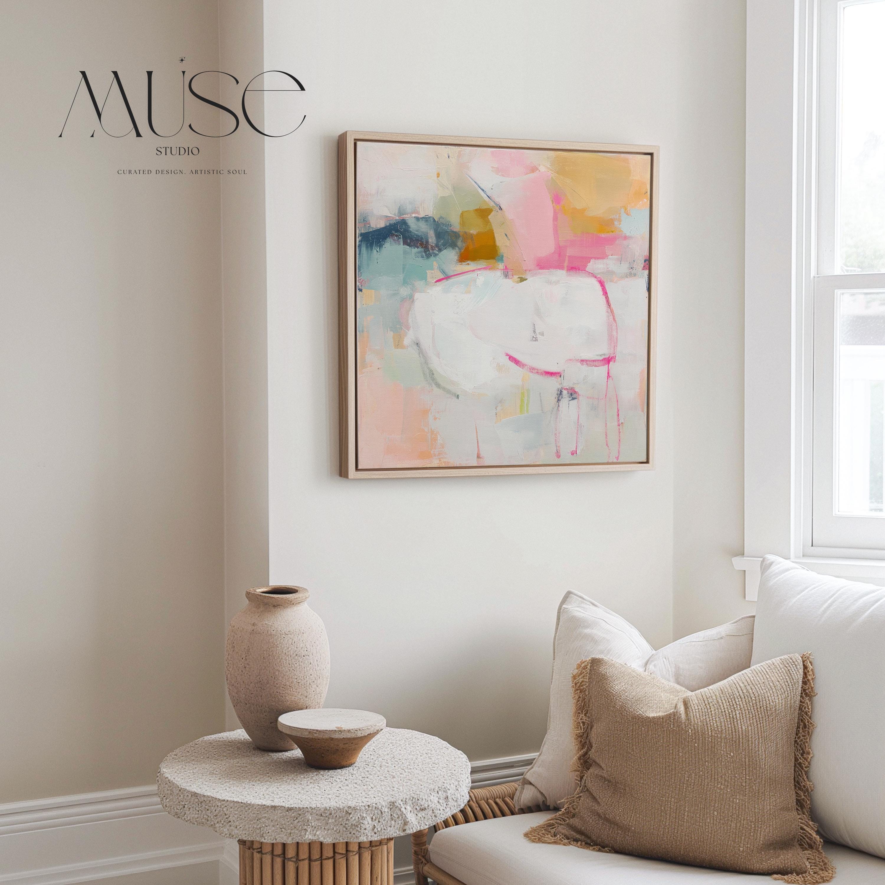 Square framed abstract wall art featuring soft pink, white, aqua, and golden tones. Gentle brushstrokes create an airy, serene atmosphere perfect for pastel botanical or soft contemporary interiors. Ideal for bedrooms, living rooms, or home offices. The warm wood frame adds a refined designer touch, ready to hang and finished for a clean, gallery-style look. Available as framed canvas, gallery-wrapped canvas, or fine art poster print.