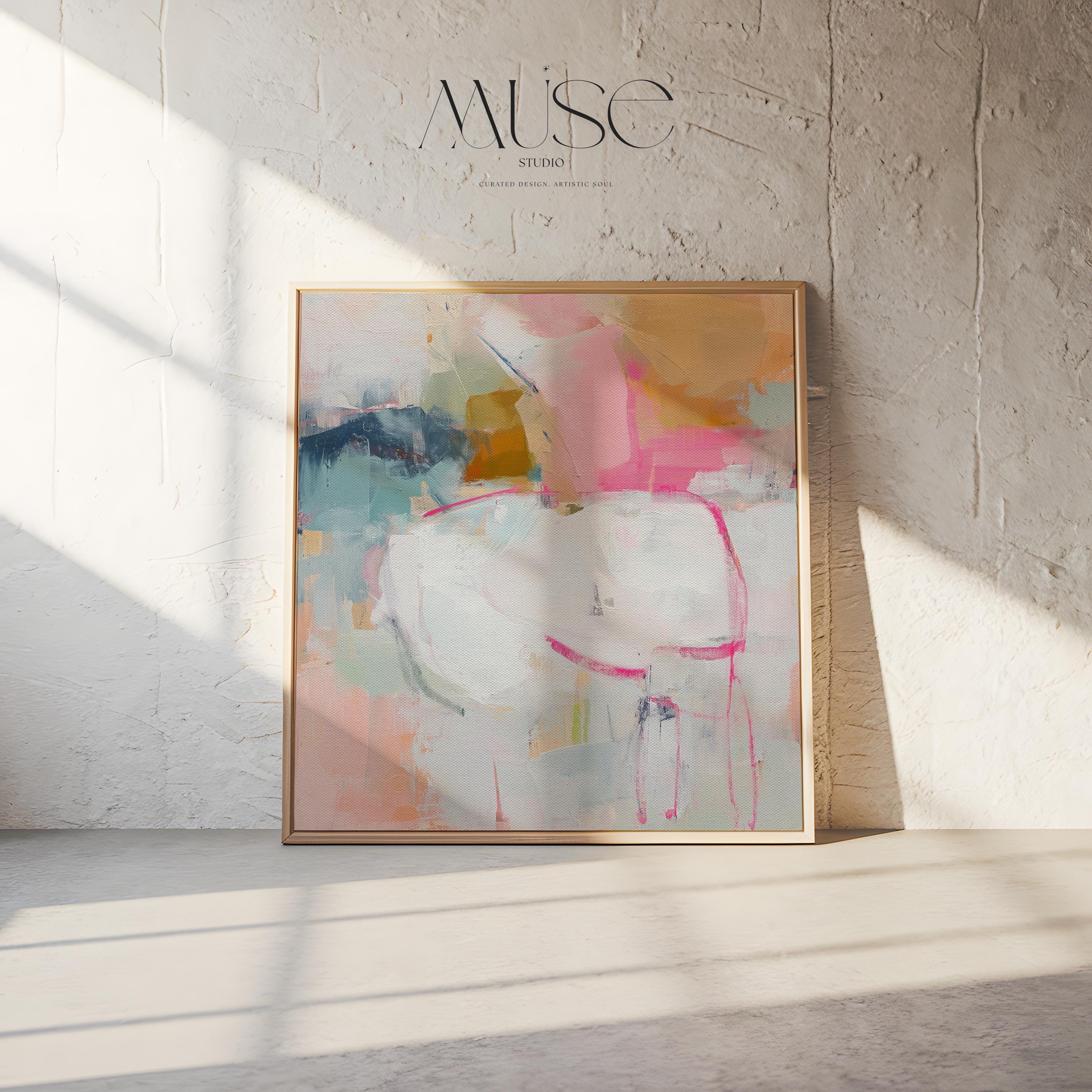 Square framed abstract wall art featuring soft pink, white, aqua, and golden tones. Gentle brushstrokes create an airy, serene atmosphere perfect for pastel botanical or soft contemporary interiors. Ideal for bedrooms, living rooms, or home offices. The warm wood frame adds a refined designer touch, ready to hang and finished for a clean, gallery-style look. Available as framed canvas, gallery-wrapped canvas, or fine art poster print.