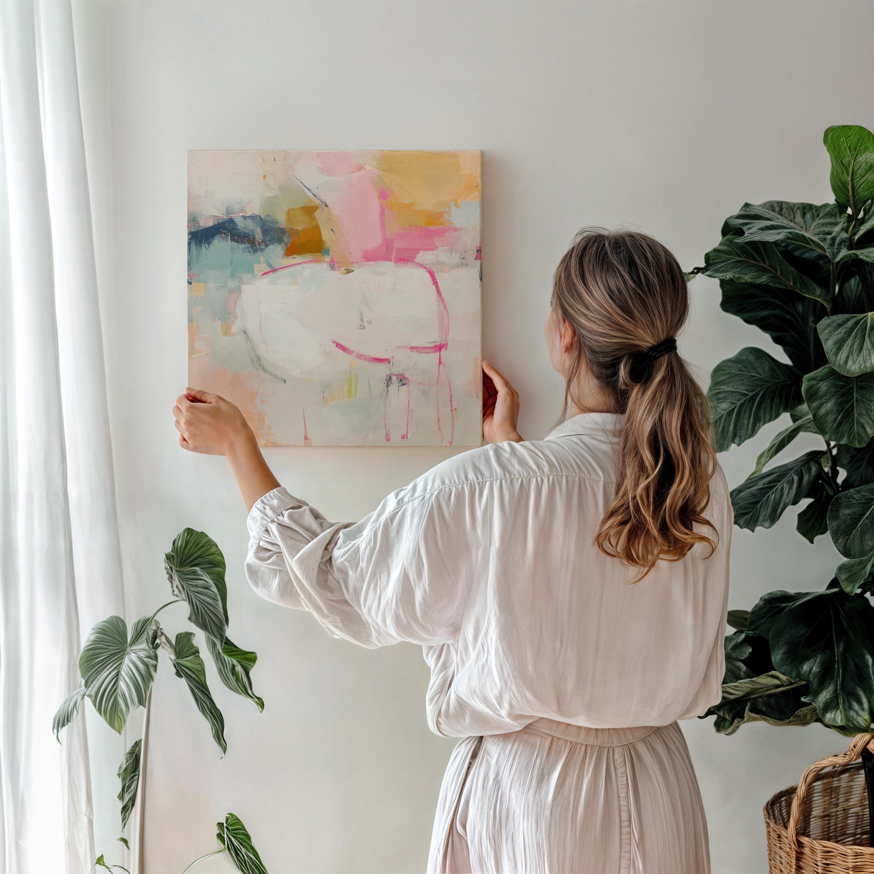Square abstract canvas wall art featuring soft pink, white, and aqua hues with golden undertones. Gentle brushstrokes add depth and light, ideal for pastel botanical or soft contemporary interiors. Perfect for bedrooms, living rooms, or creative studio spaces. Gallery-wrapped canvas wall art, ready to hang with a smooth, fine-textured finish for a refined, modern look.
