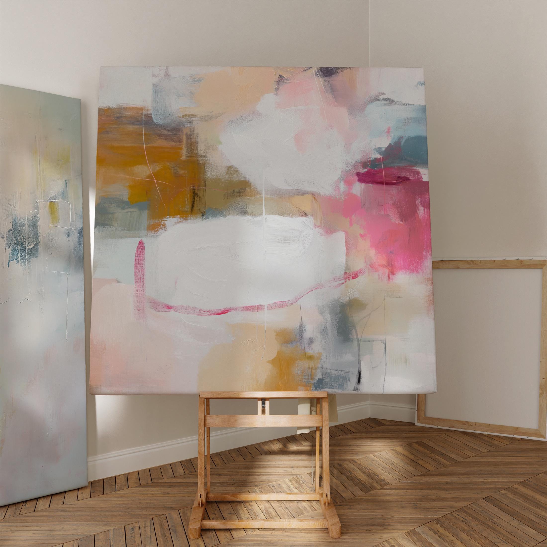 Square abstract canvas wall art in warm pink, ochre, teal, and white tones. The layered brushwork and soft composition bring light and warmth to soft contemporary or pastel botanical interiors. Perfect for living rooms, bedrooms, or modern open spaces, this piece adds refined texture and color. Gallery-wrapped canvas wall art with a smooth, fine-textured finish, ready to hang for a clean, designer look.