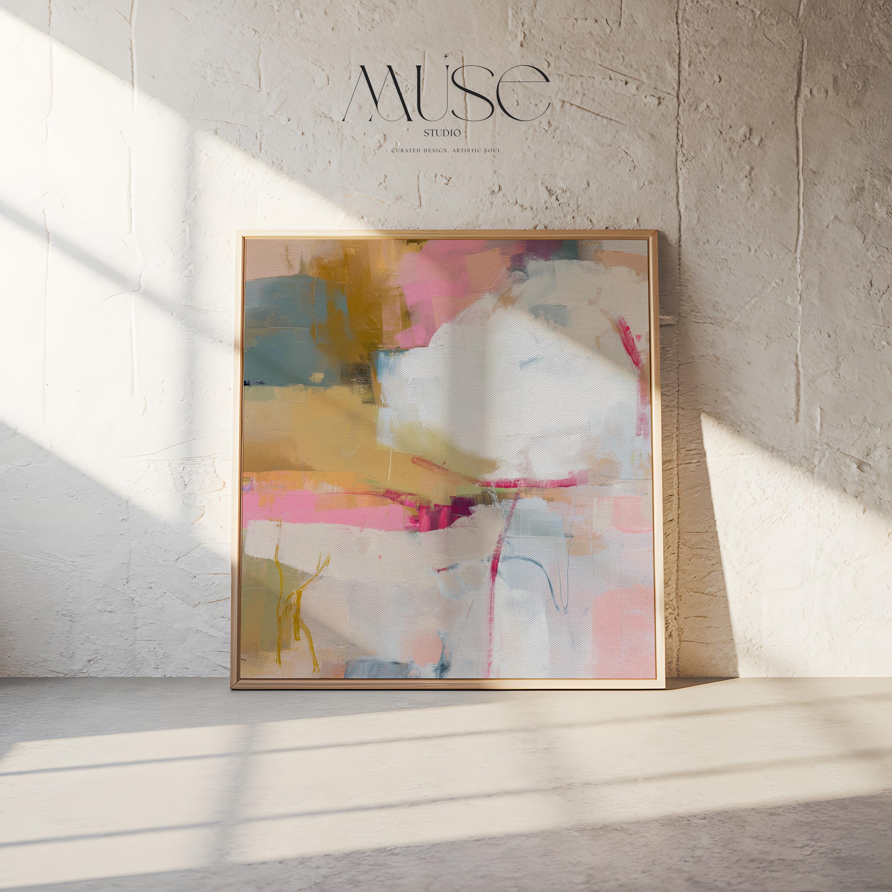 Square abstract wall art in soft pink, mustard, white, and teal tones framed in natural wood and displayed on a clean white wall. Light pastel contemporary artwork with gentle brushwork, ideal for modern living rooms, bedrooms, or designer interiors. Available as framed canvas or giclée print by Muse Studio.