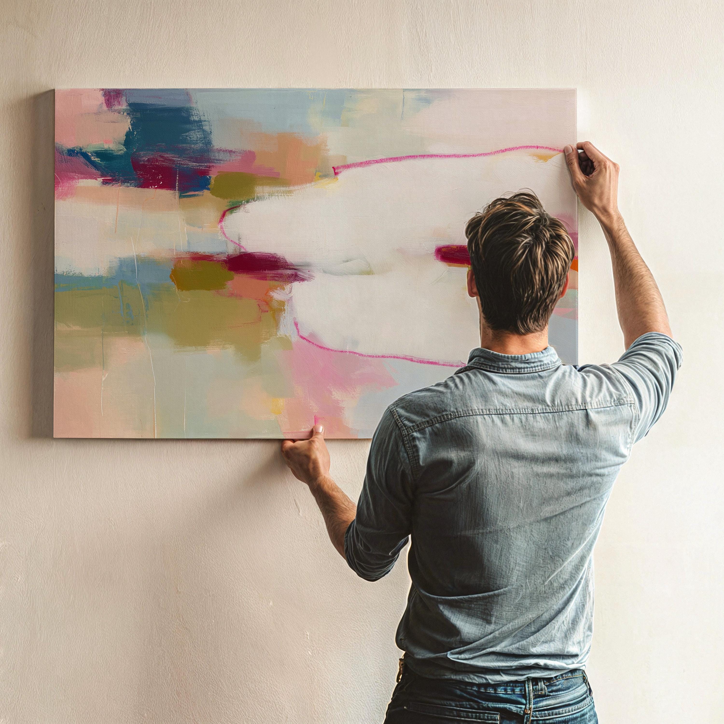 Large horizontal abstract canvas wall art featuring pink, ivory, moss green, and coral tones. Soft brushwork and layered texture create a refined, serene look perfect for soft contemporary interiors. Ideal for living rooms, bedrooms, or office spaces. Gallery-wrapped canvas wall art with a smooth, fine-textured finish, ready to hang for a polished, designer presentation.