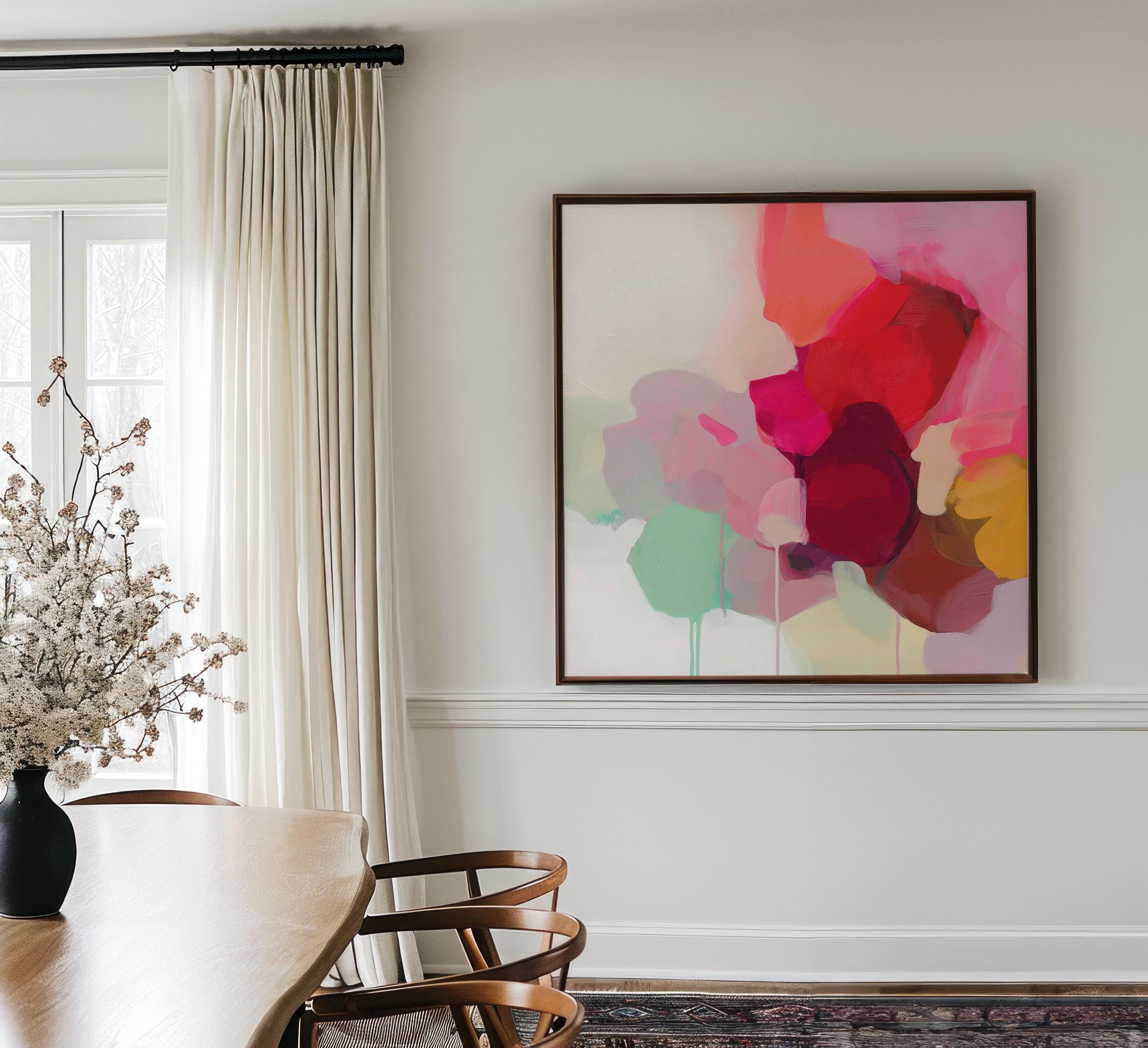 Large square abstract wall art in vivid red, pink, plum, and green hues with layered brushwork and soft tonal transitions. Designed for Color Pop interiors, this vibrant canvas creates a statement centerpiece in living rooms or modern spaces. Gallery-wrapped canvas wall art with fine texture and a clean, frameless presentation, ready to hang and elevate any room with bright, joyful color.