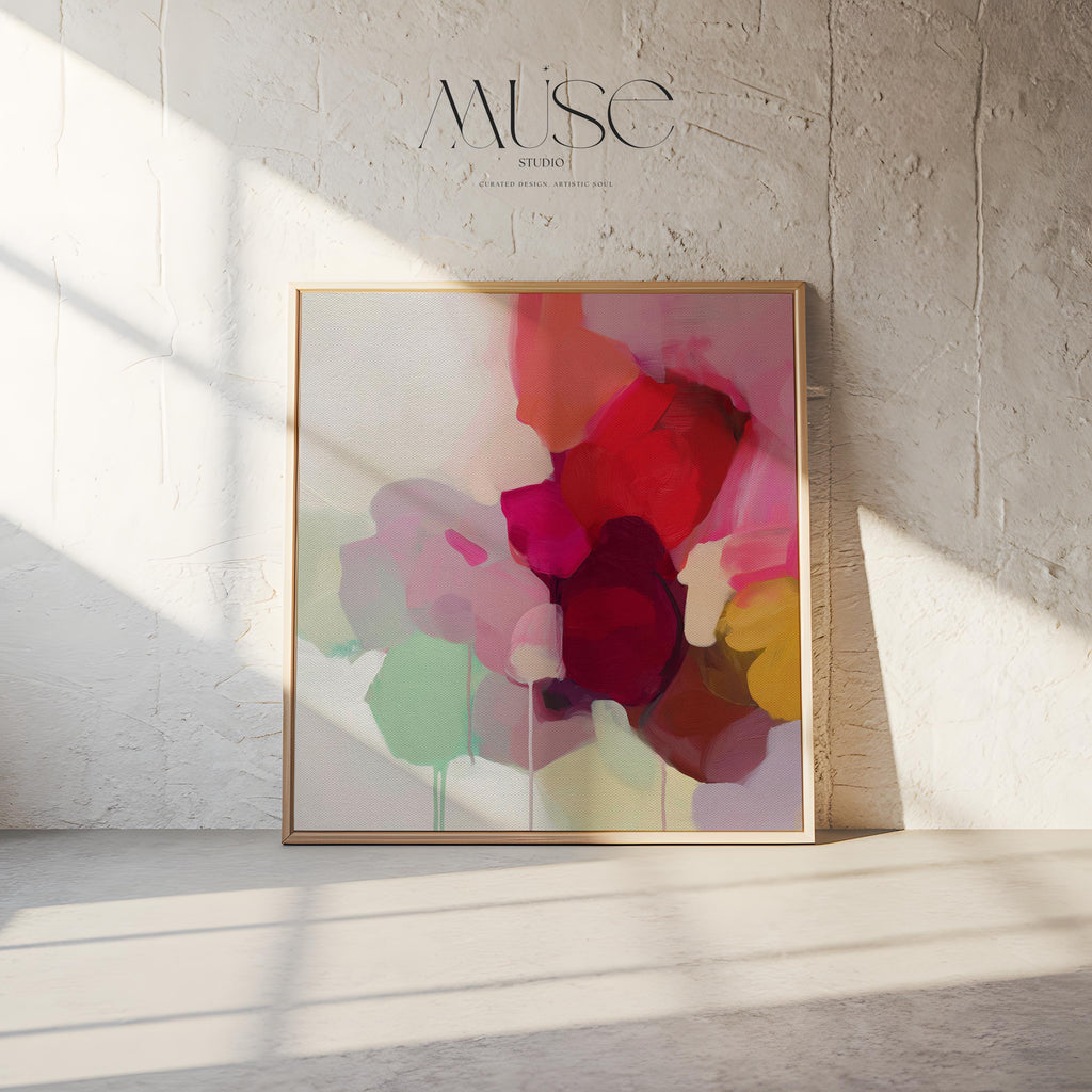 Large square abstract wall art in vivid red, pink, plum, and green hues with layered brushwork and soft tonal transitions. Designed for Color Pop interiors, this vibrant canvas creates a statement centerpiece in living rooms or modern spaces. Gallery-wrapped canvas wall art with fine texture and a clean, frameless presentation, ready to hang and elevate any room with bright, joyful color.