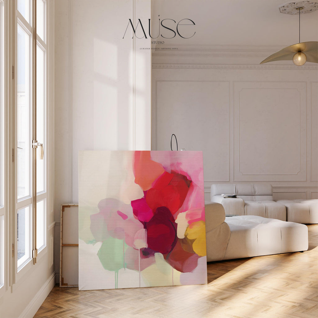 Large square abstract wall art featuring crimson, rose, plum, and soft green tones. This vibrant piece blends fluid color transitions with expressive brushwork, perfect for Color Pop or Soft Contemporary interiors. Ideal for living rooms or creative spaces. Gallery-wrapped canvas wall art with a fine-textured surface, ready to hang and infuse any room with bold, joyful color.
