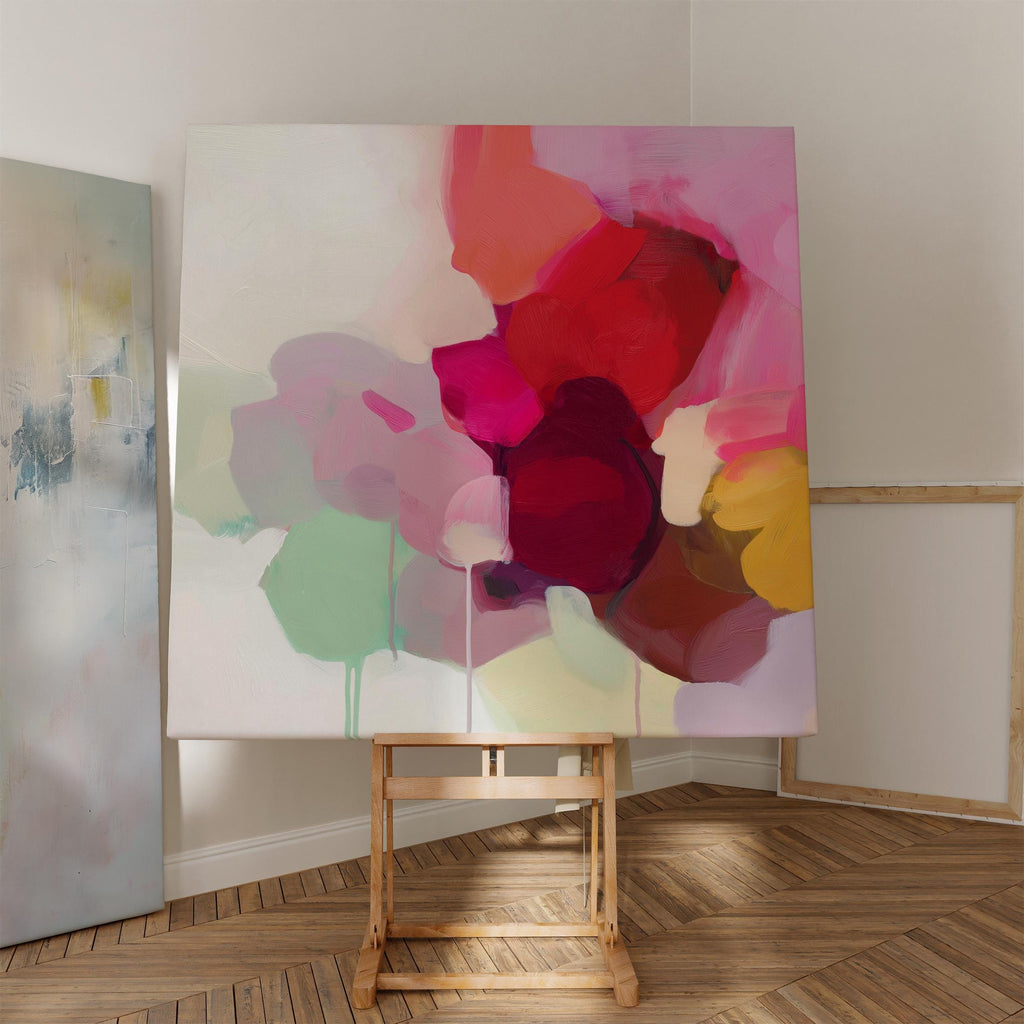 Large square abstract wall art featuring crimson, rose, plum, and soft green tones. This vibrant piece blends fluid color transitions with expressive brushwork, perfect for Color Pop or Soft Contemporary interiors. Ideal for living rooms or creative spaces. Gallery-wrapped canvas wall art with a fine-textured surface, ready to hang and infuse any room with bold, joyful color.