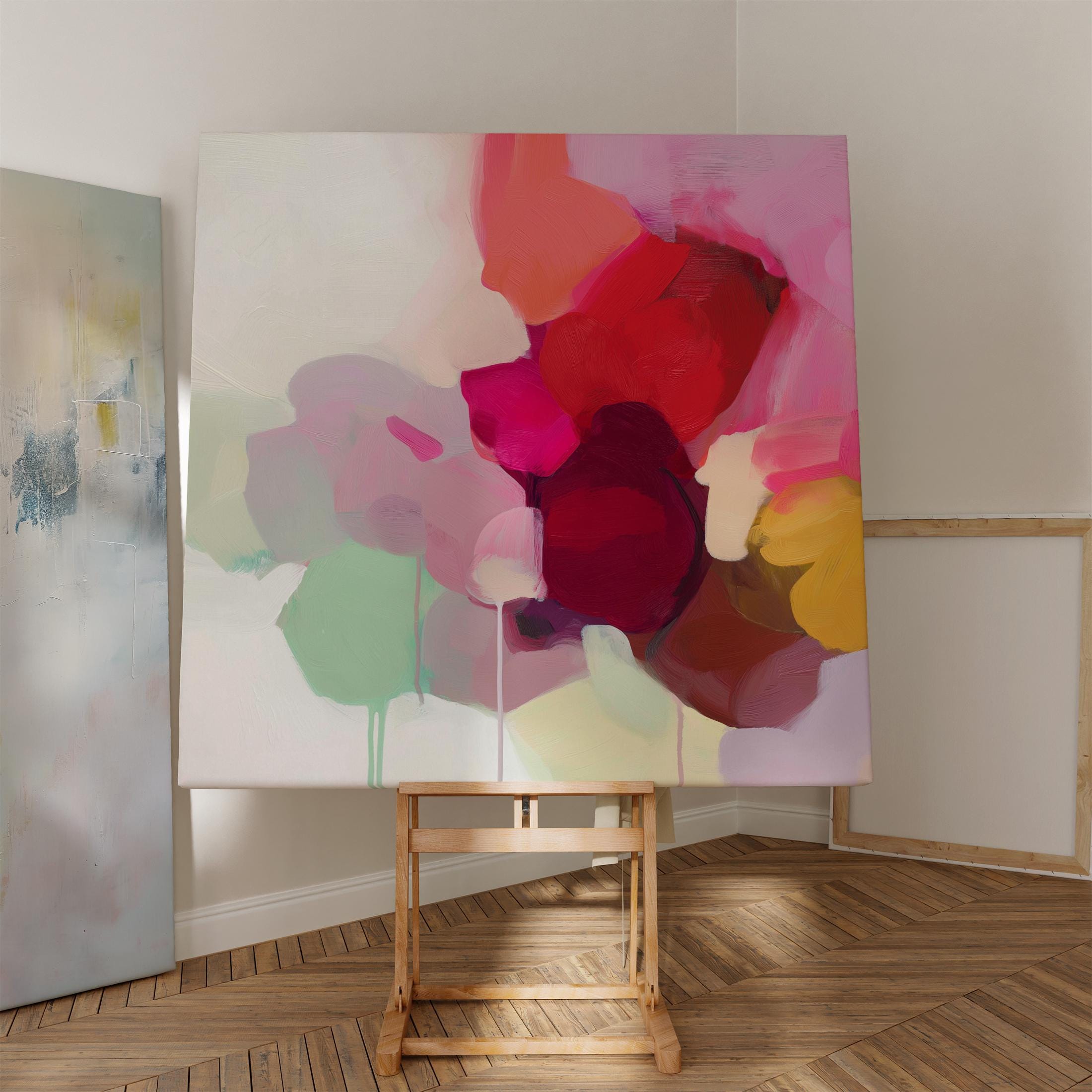 Large square abstract wall art featuring crimson, rose, plum, and soft green tones. This vibrant piece blends fluid color transitions with expressive brushwork, perfect for Color Pop or Soft Contemporary interiors. Ideal for living rooms or creative spaces. Gallery-wrapped canvas wall art with a fine-textured surface, ready to hang and infuse any room with bold, joyful color.