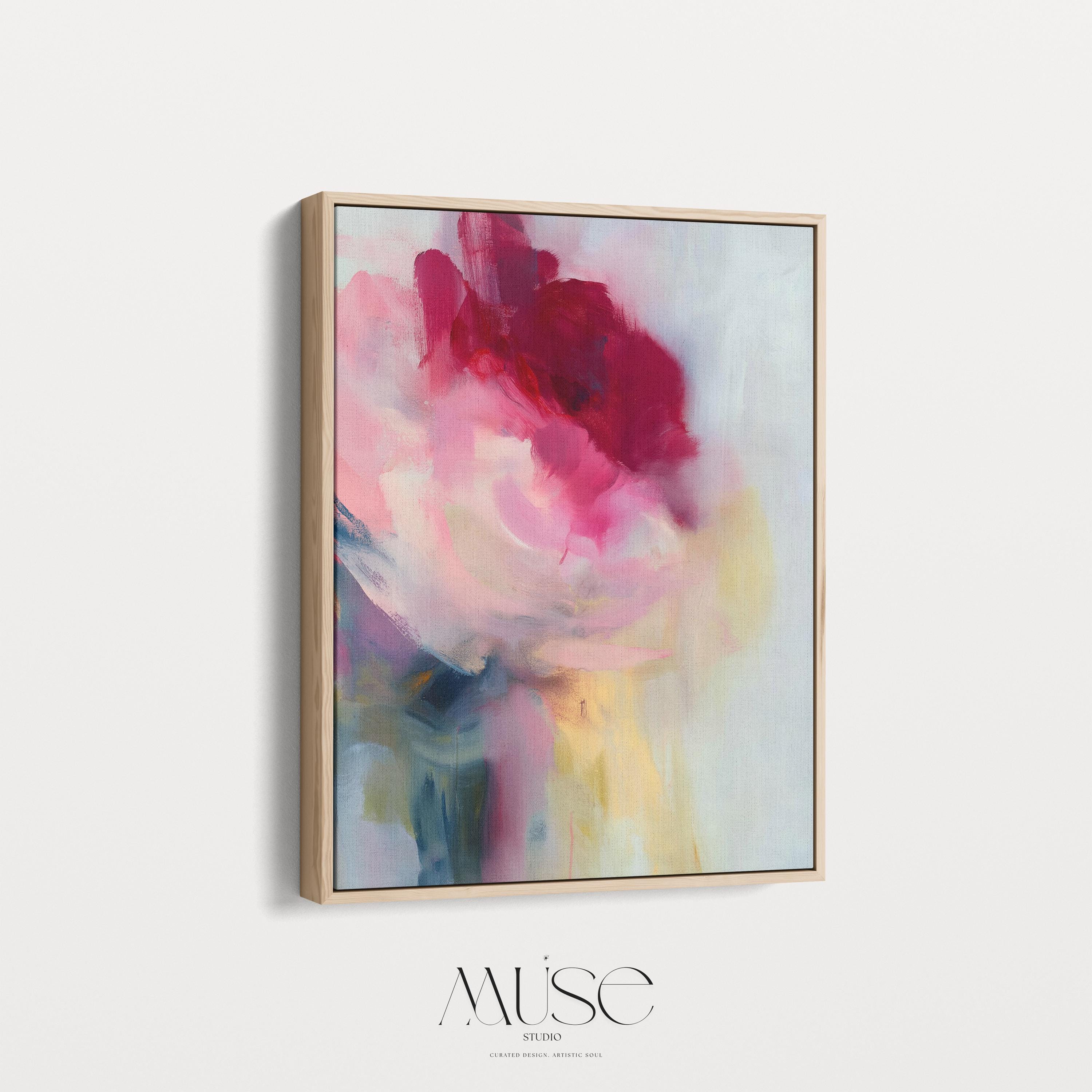 Vertical abstract wall art in soft pink, rose, and misty blue tones, blending painterly layers with an airy, luminous finish. Ideal for bedrooms or entryways, this soft contemporary design adds tranquility and subtle color. Floater framed in FSC-certified wood with a natural finish, printed on archival cotton-blend canvas for premium wall decor.