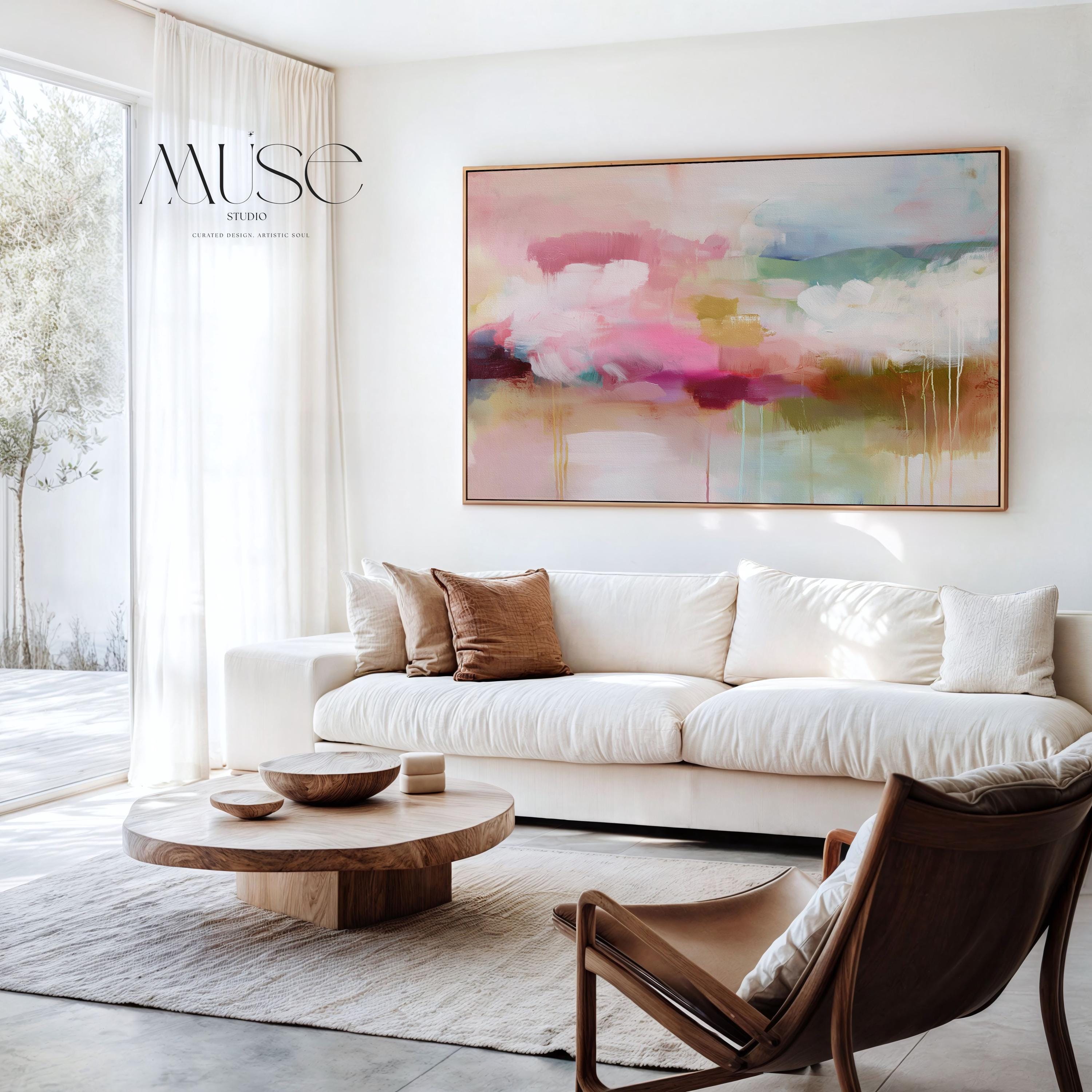 Horizontal framed abstract wall art blending blush pink, sage green, and golden umber with soft painterly drips. A warm minimalist design that evokes natural horizons and organic calm, ideal for living rooms, dining spaces, or design studios. Floater framed in FSC-certified wood with archival cotton-blend canvas for a gallery-quality presentation.