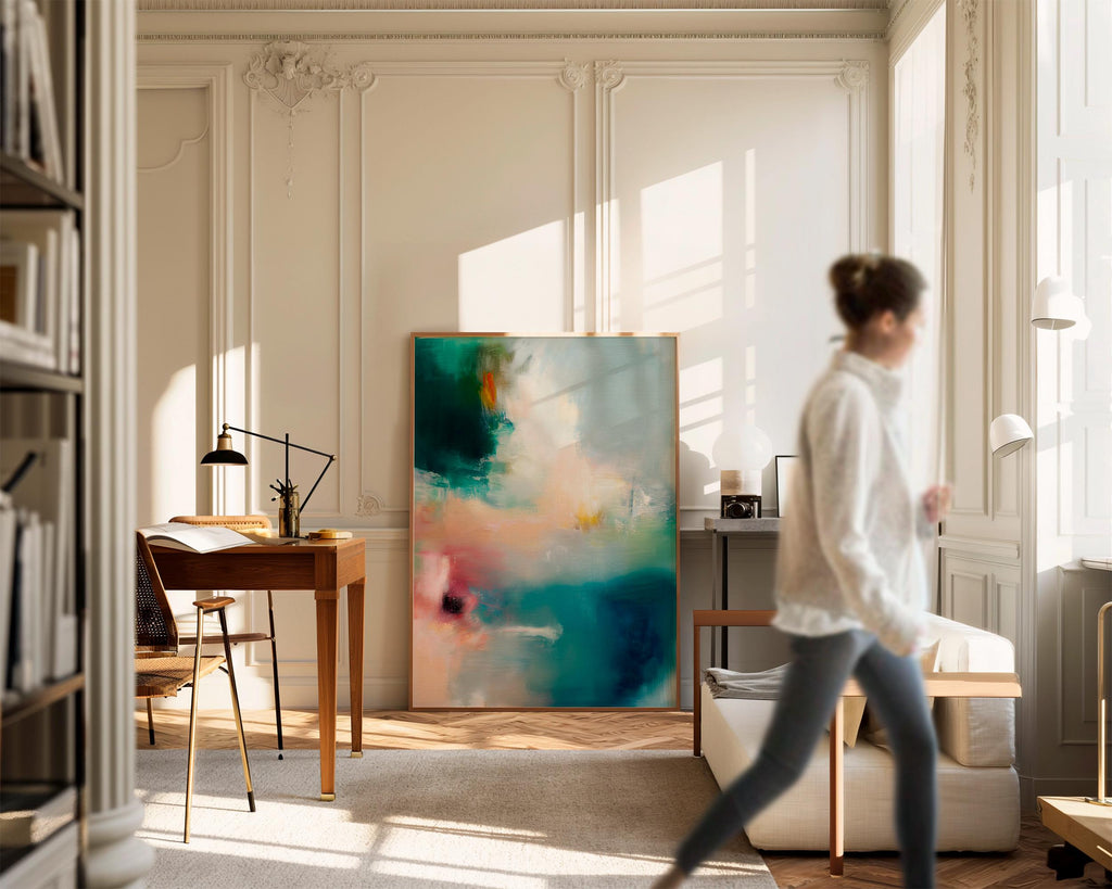 Vertical abstract canvas wall art featuring teal, blush, and gold tones with layered brushwork. The soft contemporary palette enhances modern and transitional interiors, ideal for bedrooms or living spaces. Available as a framed or gallery-wrapped canvas for designer-inspired decor.
