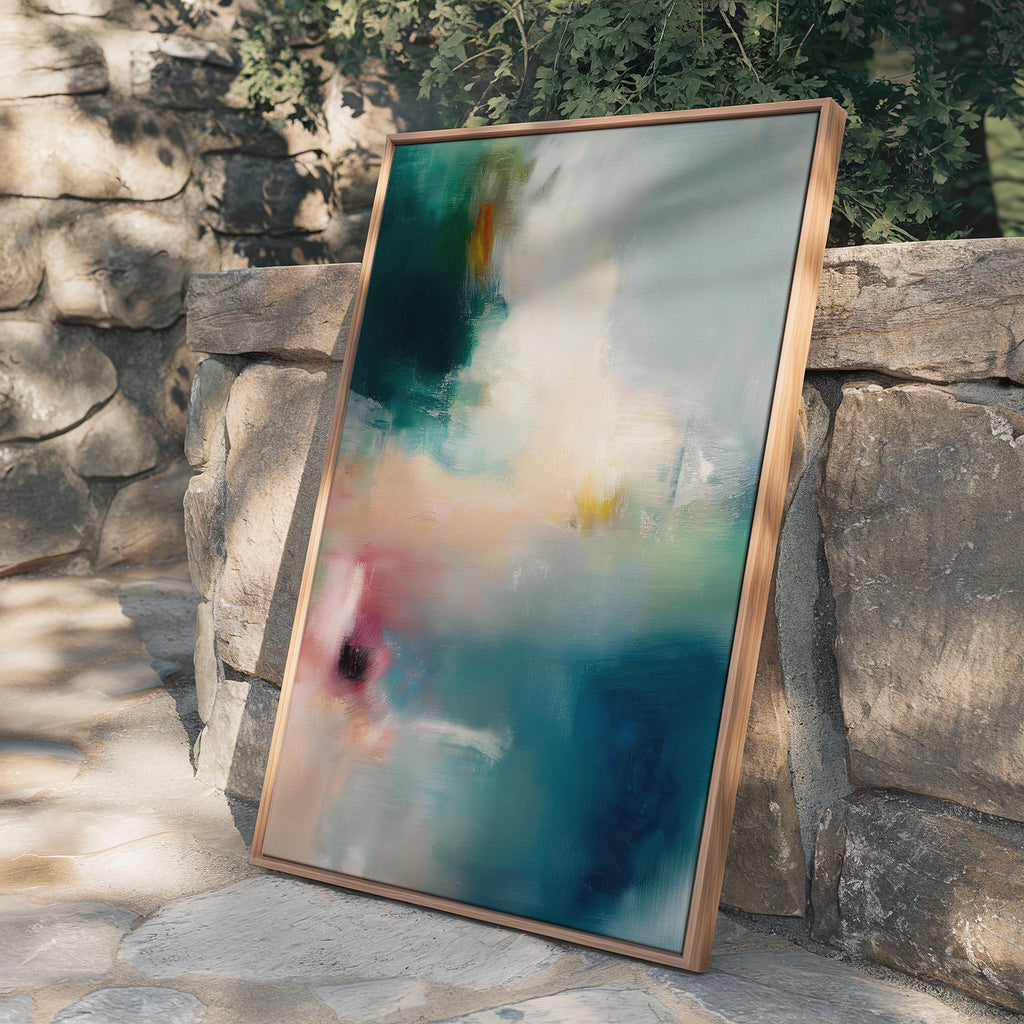 Vertical abstract canvas wall art featuring teal, blush, and gold tones with layered brushwork. The soft contemporary palette enhances modern and transitional interiors, ideal for bedrooms or living spaces. Available as a framed or gallery-wrapped canvas for designer-inspired decor.