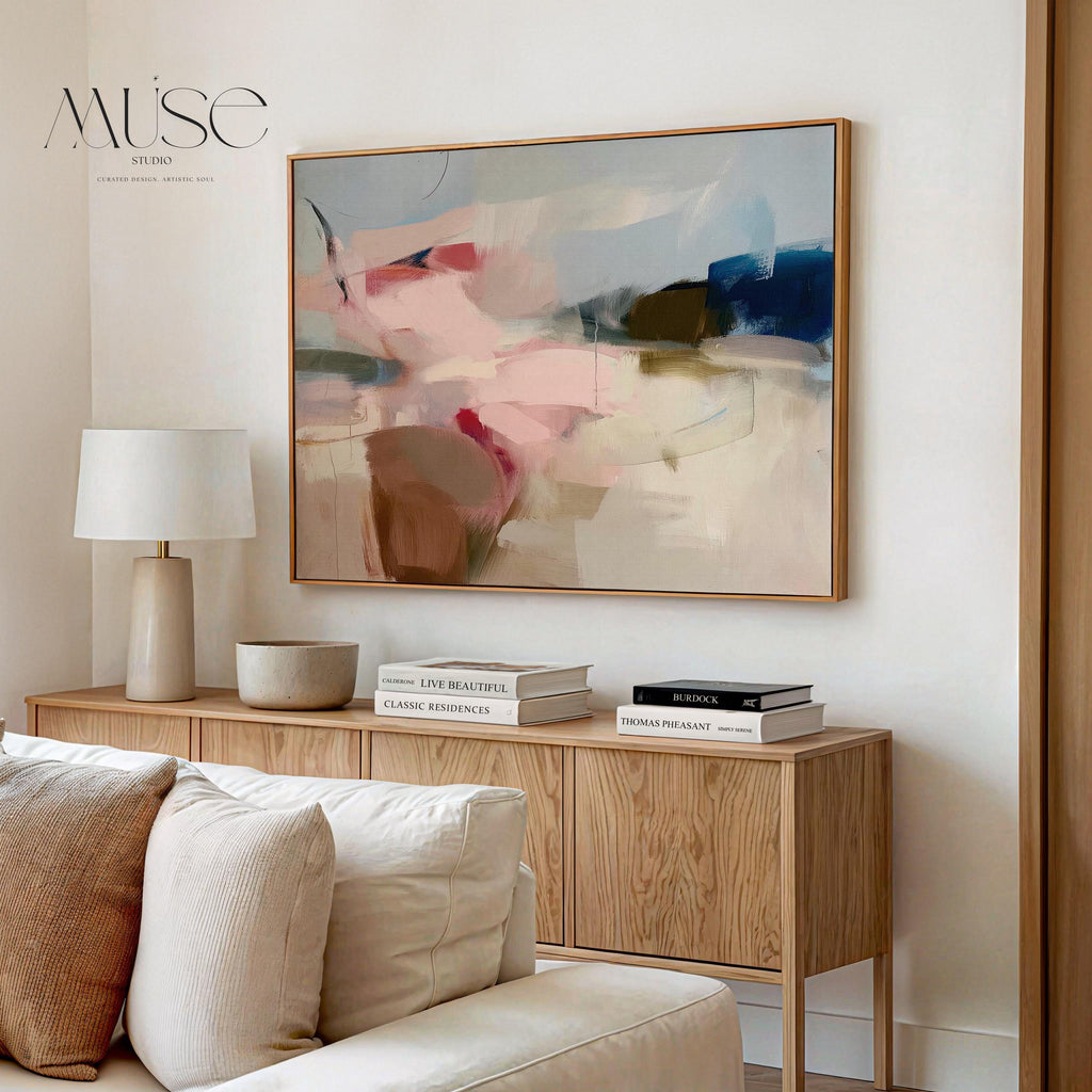 Horizontal abstract canvas wall art in soft blush, navy, and taupe tones with gentle painterly movement. The textured brushwork evokes warmth and calm, ideal for modern living rooms or bedrooms. Printed on premium cotton canvas, this gallery-wrapped piece arrives ready to hang for a clean, contemporary finish.