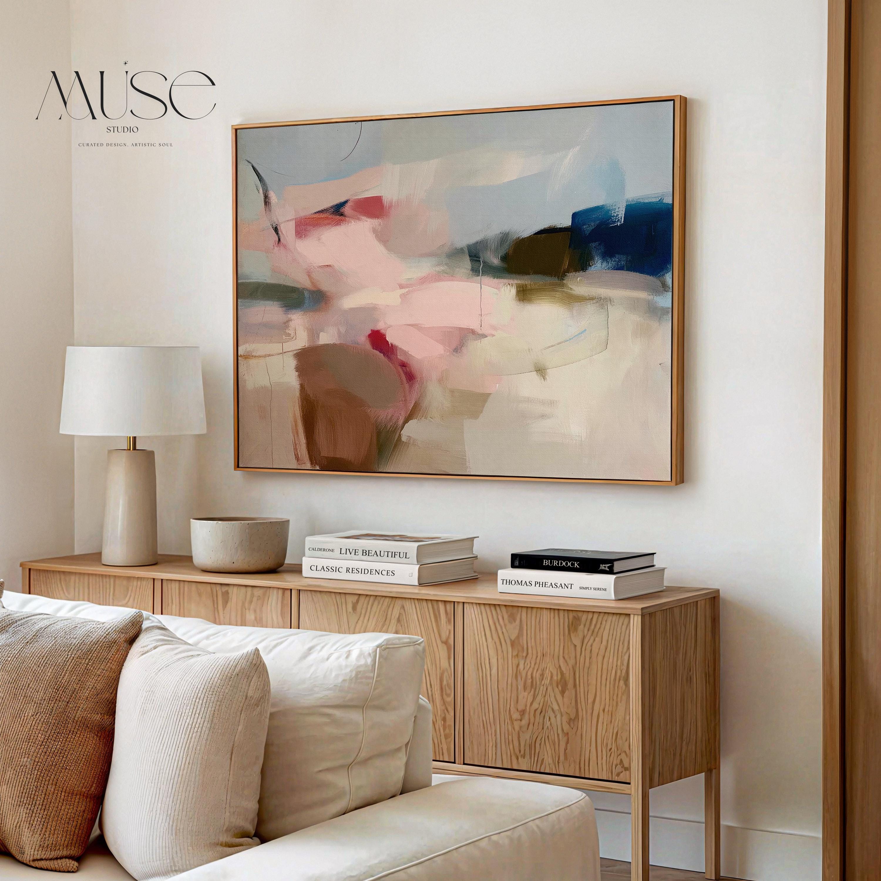 Horizontal abstract canvas wall art in soft blush, navy, and taupe tones with gentle painterly movement. The textured brushwork evokes warmth and calm, ideal for modern living rooms or bedrooms. Printed on premium cotton canvas, this gallery-wrapped piece arrives ready to hang for a clean, contemporary finish.