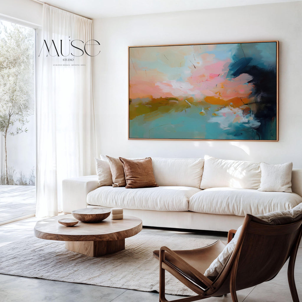 Horizontal framed abstract artwork featuring soft turquoise, peach, and gold tones inspired by ocean horizons. Ideal for Coastal Horizon interiors, this piece brings calm energy and warmth to living rooms, beach houses, or modern spaces. Printed on archival cotton-blend canvas, hand-stretched, and framed in natural wood for a refined, gallery-quality finish.