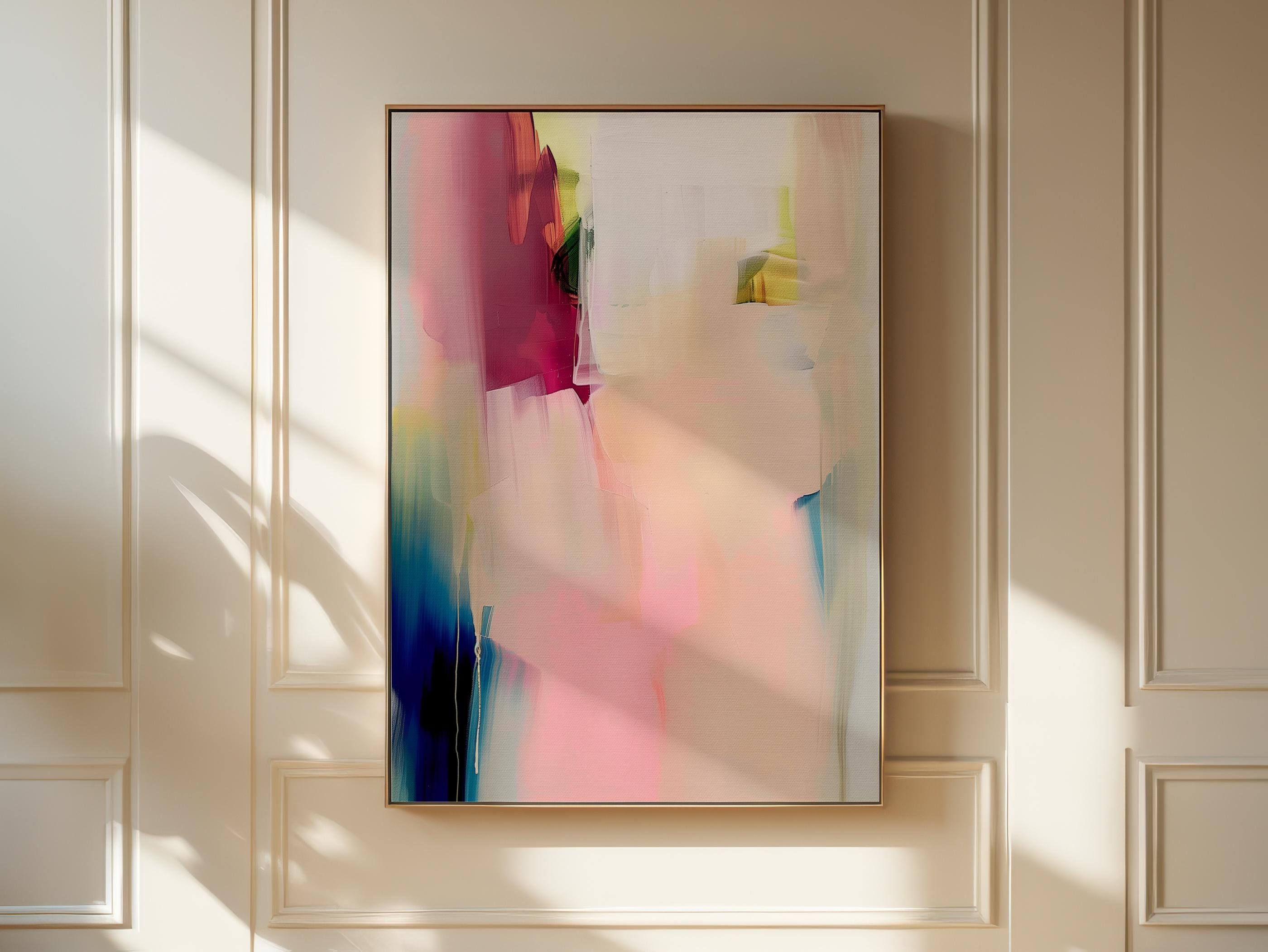 Vertical framed canvas wall art in soft blush rose, ivory, and coral tones, layered with hints of cobalt and gold. Gentle painterly motion evokes calm elegance, ideal for Soft Contemporary and Warm Neutral interiors. Perfect for living rooms or entryways. Handcrafted fine art giclée on cotton canvas.