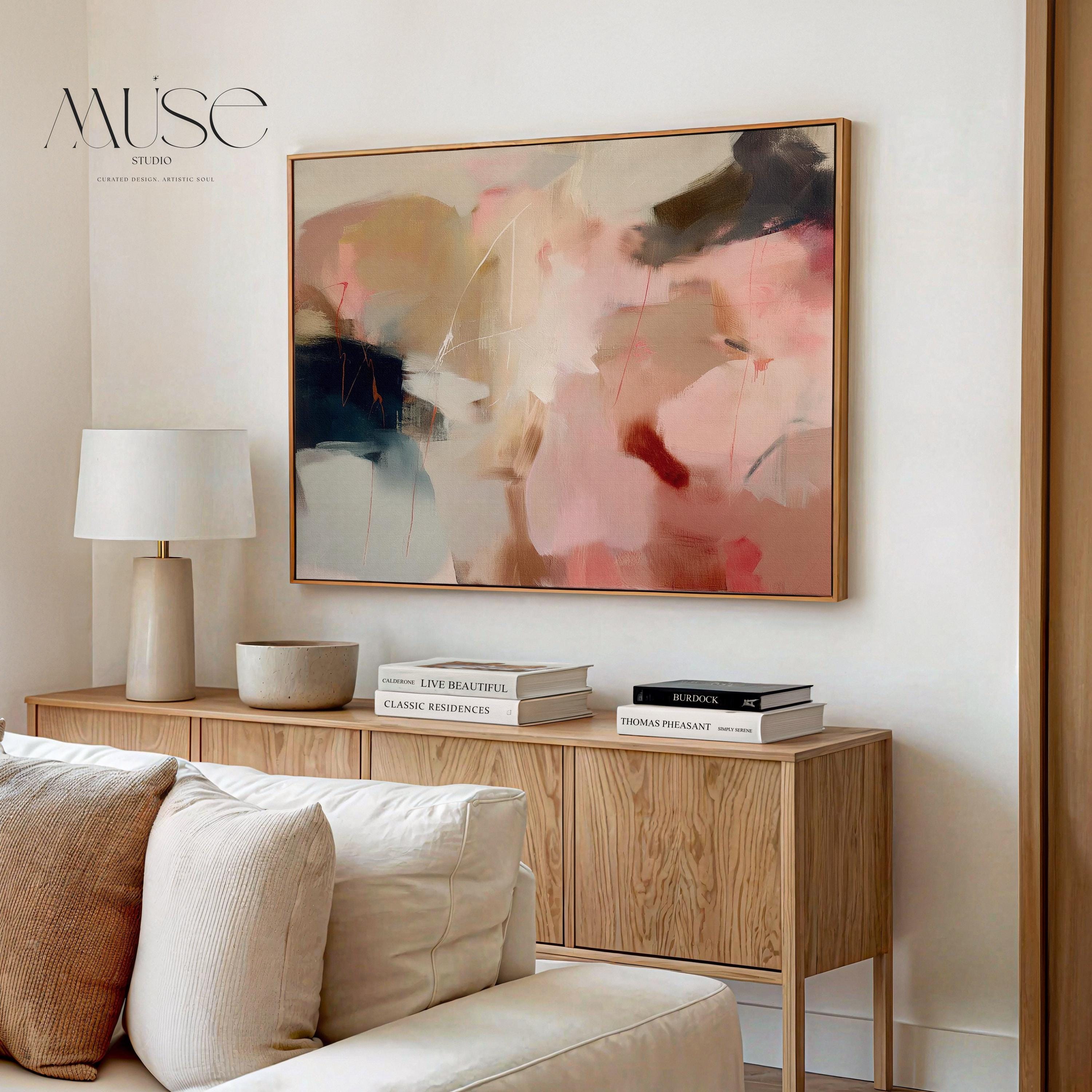 Horizontal abstract wall art in blush pink, beige, and navy tones framed in natural wood. This soft contemporary design blends fluid movement with a calm, elegant palette—ideal for warm minimalist or transitional interiors. Perfect for living rooms, bedrooms, or entryways seeking refined, serene decor. Available as a framed canvas wall art, gallery-wrapped canvas, or fine art poster print.