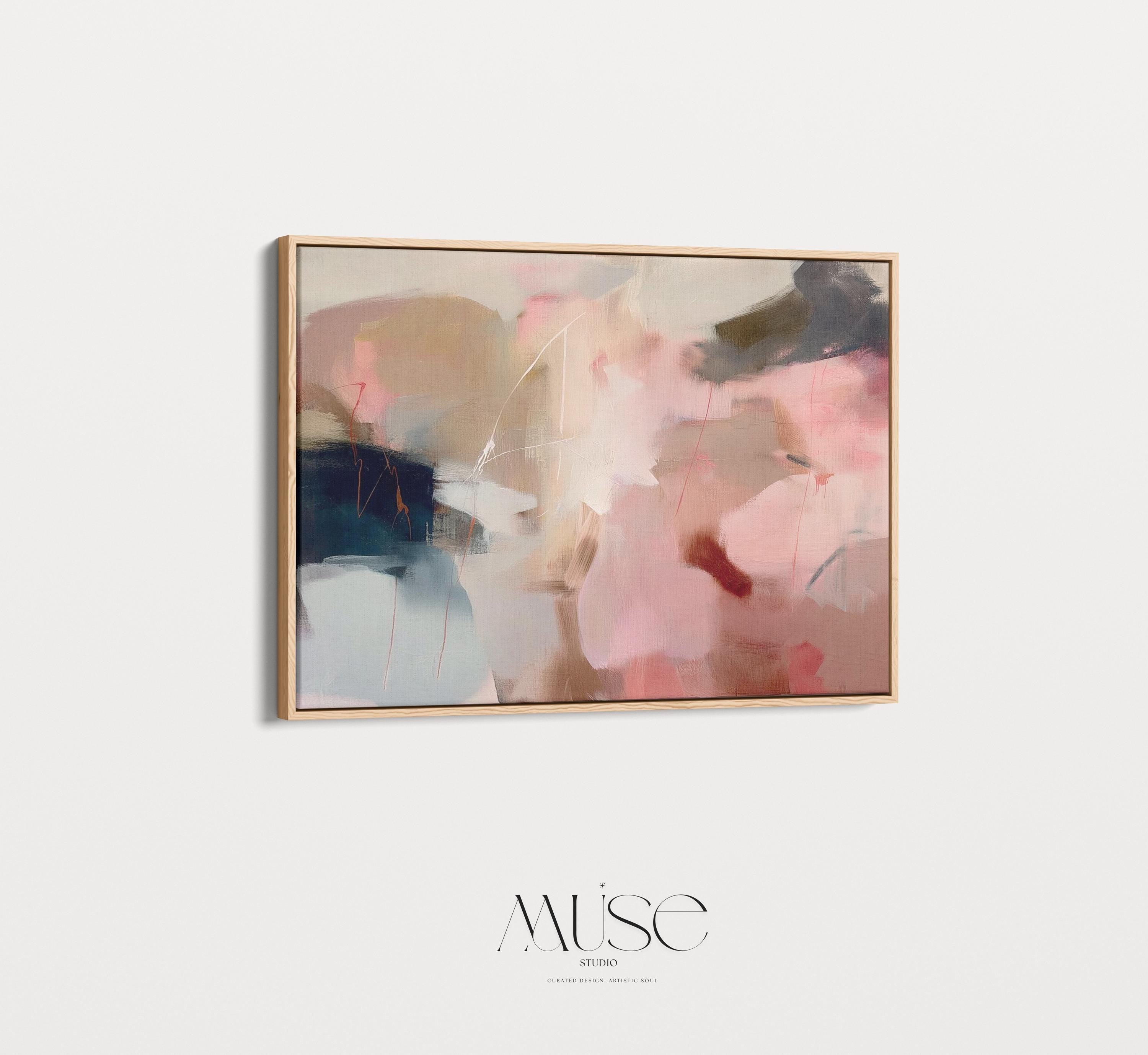 Horizontal abstract wall art in blush pink, beige, and navy tones framed in natural wood. This soft contemporary design blends fluid movement with a calm, elegant palette—ideal for warm minimalist or transitional interiors. Perfect for living rooms, bedrooms, or entryways seeking refined, serene decor. Available as a framed canvas wall art, gallery-wrapped canvas, or fine art poster print.