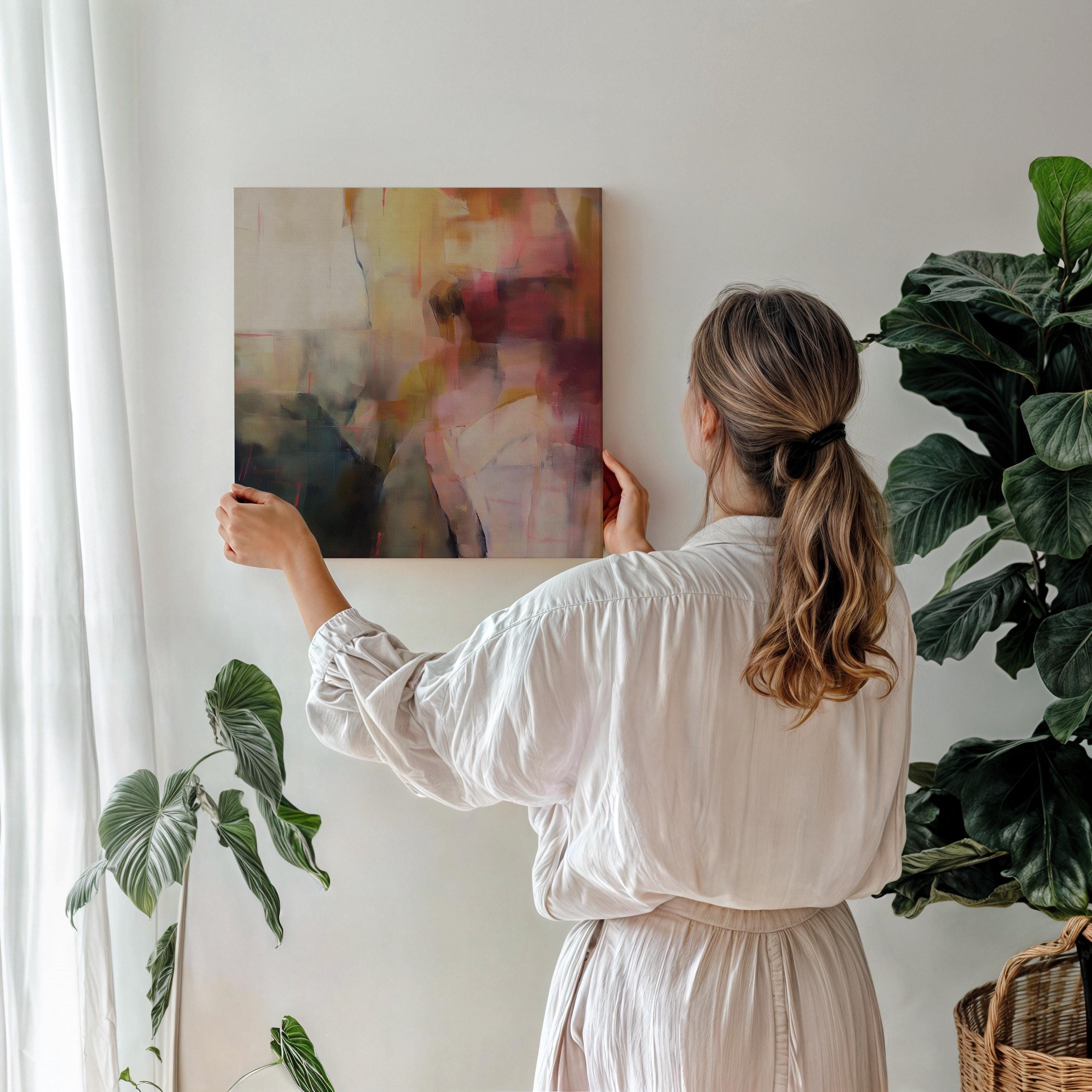 Square abstract canvas wall art featuring a moody blend of plum, blush, and gold tones. Soft painterly layers create warmth and movement, ideal for transitional or warm minimalist interiors. Perfect for bedrooms, offices, or living rooms needing an elegant focal point. This artwork adds sophistication and texture to curated, designer-inspired spaces. Gallery-wrapped canvas wall art by Muse Studio.