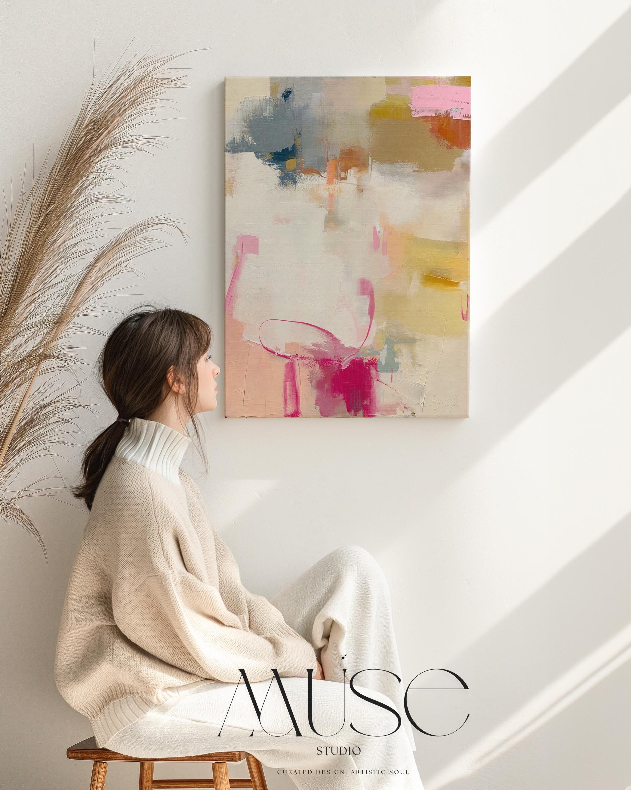 Vertical abstract canvas wall art featuring blush pink, gold, taupe, and soft blue hues in a soft contemporary color pop palette. The artwork adds warmth and elegance to modern interiors, perfect for living rooms, bedrooms, or entryways. Its layered brushwork and inviting tones create a sophisticated, designer look. Available as a gallery-wrapped canvas, framed canvas, or fine art poster print.