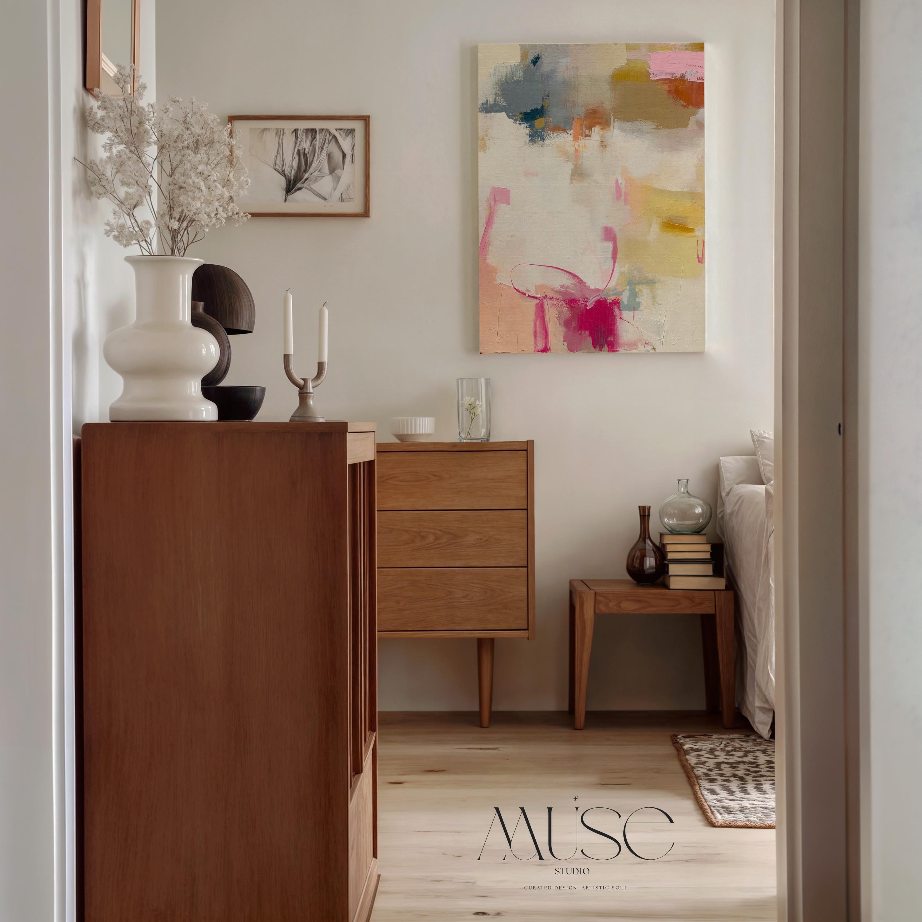 Vertical abstract canvas wall art featuring blush pink, gold, taupe, and soft blue hues in a soft contemporary color pop palette. The artwork adds warmth and elegance to modern interiors, perfect for living rooms, bedrooms, or entryways. Its layered brushwork and inviting tones create a sophisticated, designer look. Available as a gallery-wrapped canvas, framed canvas, or fine art poster print.