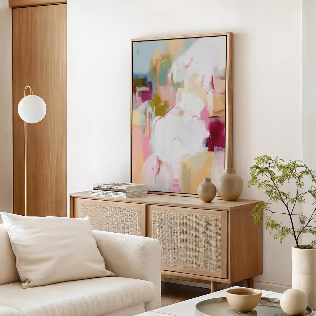 Vertical framed abstract wall art featuring pink, cream, olive, and berry hues. Soft brushwork creates a calm yet uplifting mood, ideal for pastel botanical and soft contemporary interiors. Perfect for living rooms, bedrooms, or entryways, the artwork adds warmth and modern refinement. Each framed wall art piece is crafted with a sleek wood frame, clean lines, and a gallery-quality finish, ready to hang for a polished designer look.