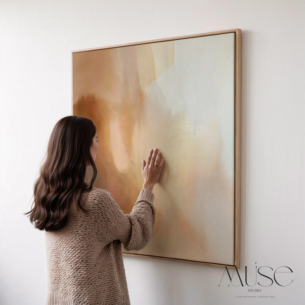 Large warm minimal abstract canvas wall art in beige, brown, and cream hues. Soft painterly transitions create a soothing, elegant statement perfect for minimalist or transitional living room decor. Available as gallery-wrapped or framed canvas for timeless interior styling.