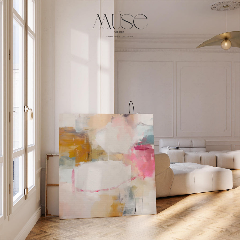 Square abstract canvas wall art in warm pink, ochre, teal, and white tones. The layered brushwork and soft composition bring light and warmth to soft contemporary or pastel botanical interiors. Perfect for living rooms, bedrooms, or modern open spaces, this piece adds refined texture and color. Gallery-wrapped canvas wall art with a smooth, fine-textured finish, ready to hang for a clean, designer look.