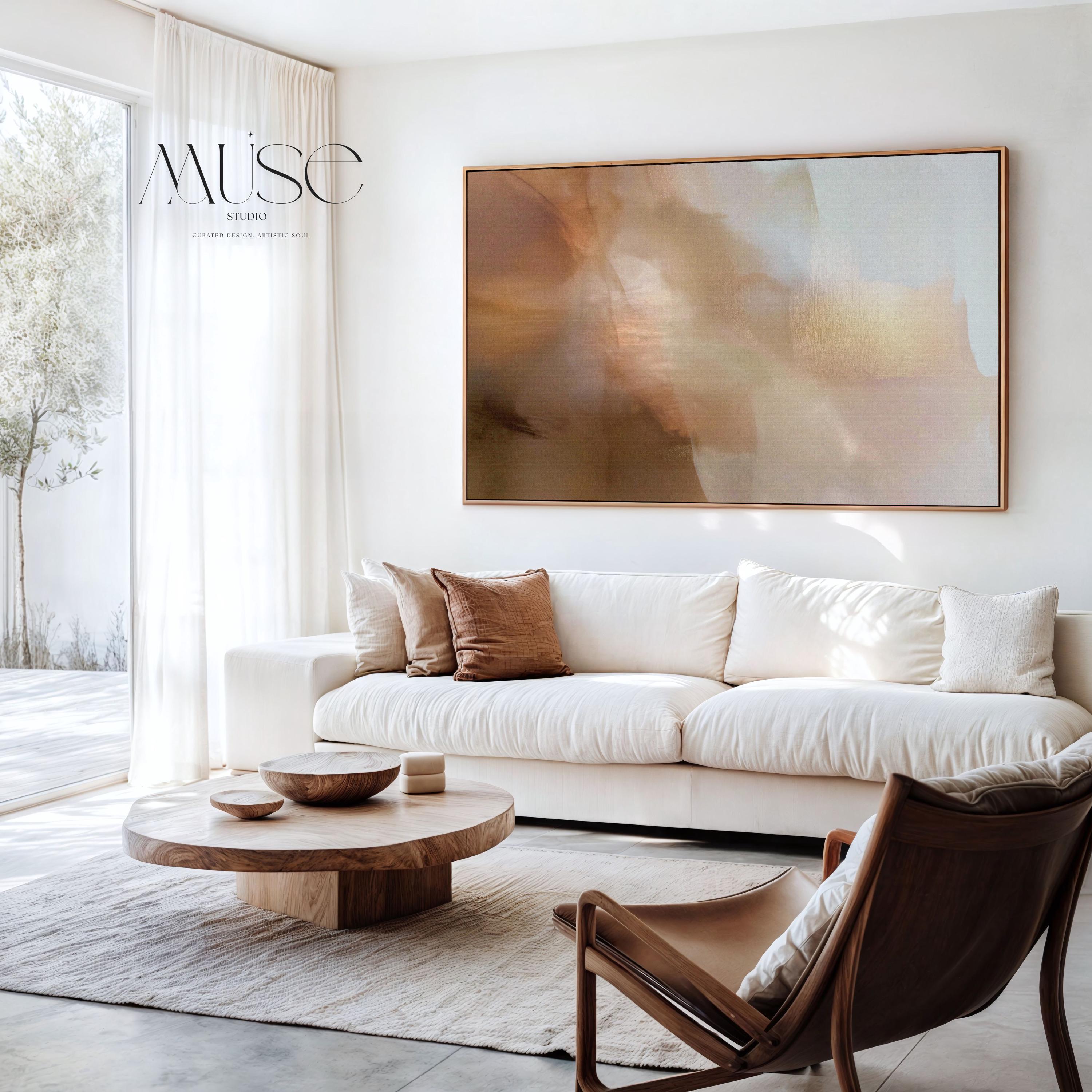 Horizontal warm-neutral abstract wall art in beige, sand, and ivory tones, styled in a warm minimal interior with light wood and linen textures. Available as framed canvas or gallery canvas by Muse Studio.