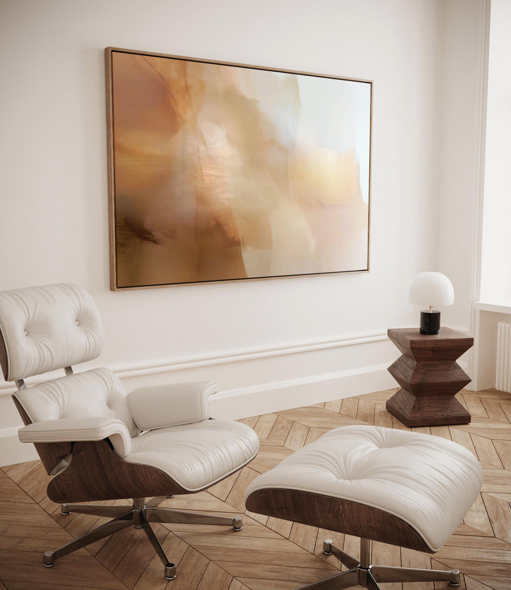 Horizontal warm-neutral abstract wall art in beige, sand, and ivory tones, styled in a warm minimal interior with light wood and linen textures. Available as framed canvas or gallery canvas by Muse Studio.