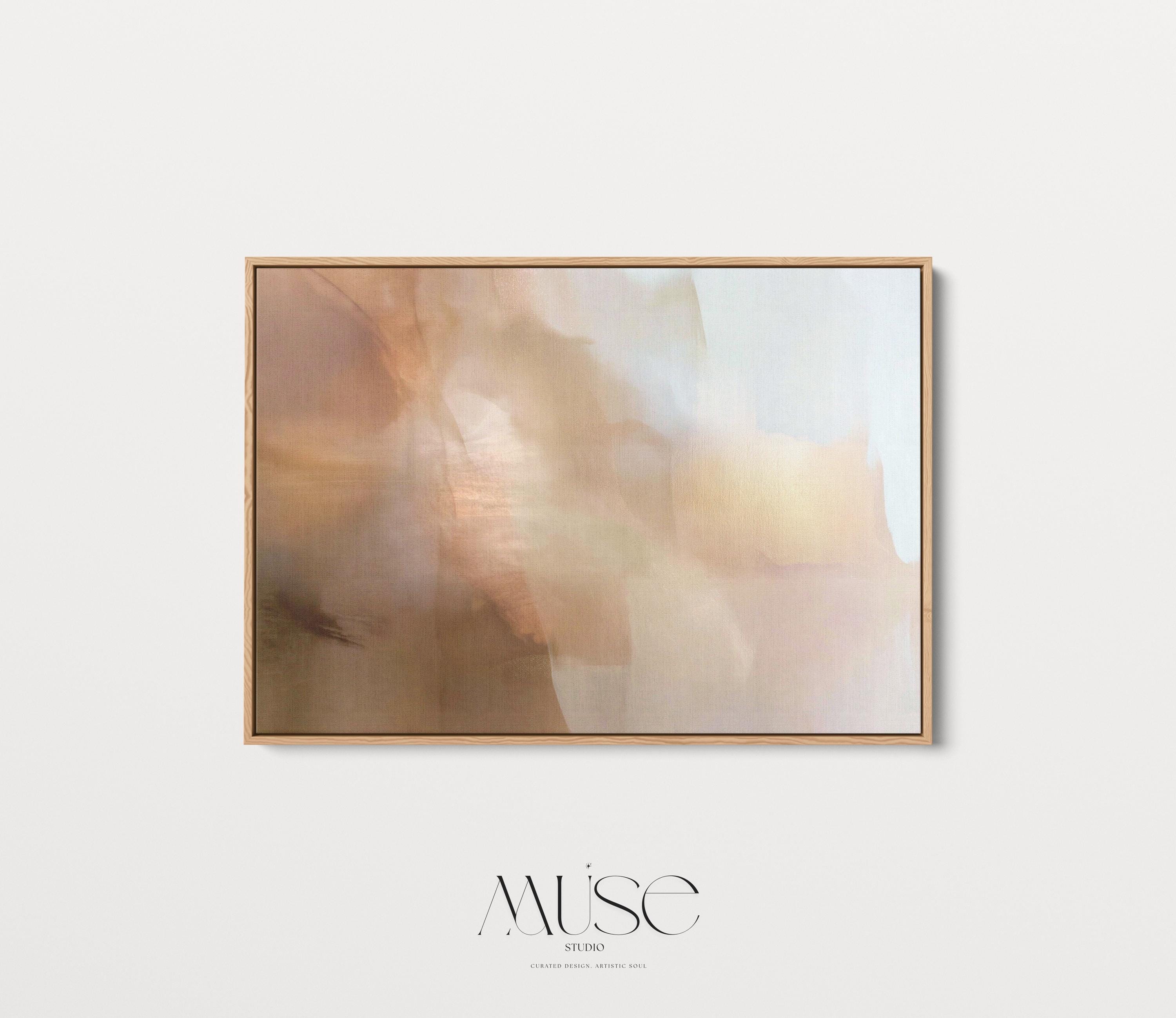 Horizontal warm-neutral abstract wall art in beige, sand, and ivory tones, styled in a warm minimal interior with light wood and linen textures. Available as framed canvas or gallery canvas by Muse Studio.