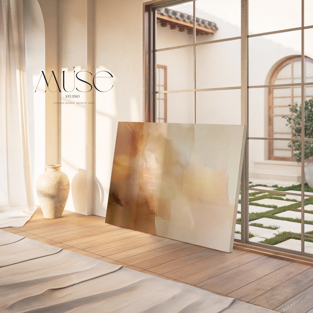 Horizontal warm-neutral abstract wall art in beige, sand, and ivory tones, styled in a warm minimal interior with light wood and linen textures. Available as framed canvas or gallery canvas by Muse Studio.